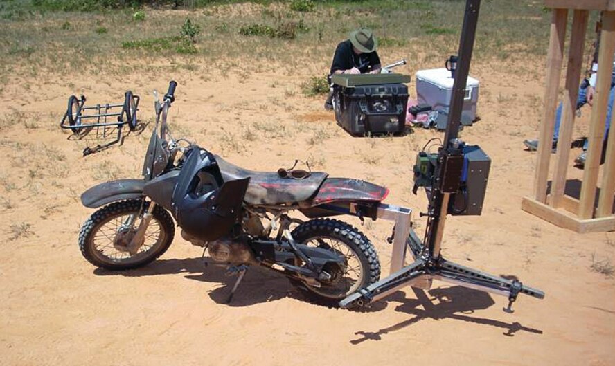 A small bike equipped with a removable hitch for a Mosquito, which provides the capability to measure ground hardness, a crucial element to landing zone preparation. The Air Force Research Laboratory responded to an urgent warfighter request, delivering the prototype for the mounting and towing mechanism in just two weeks.