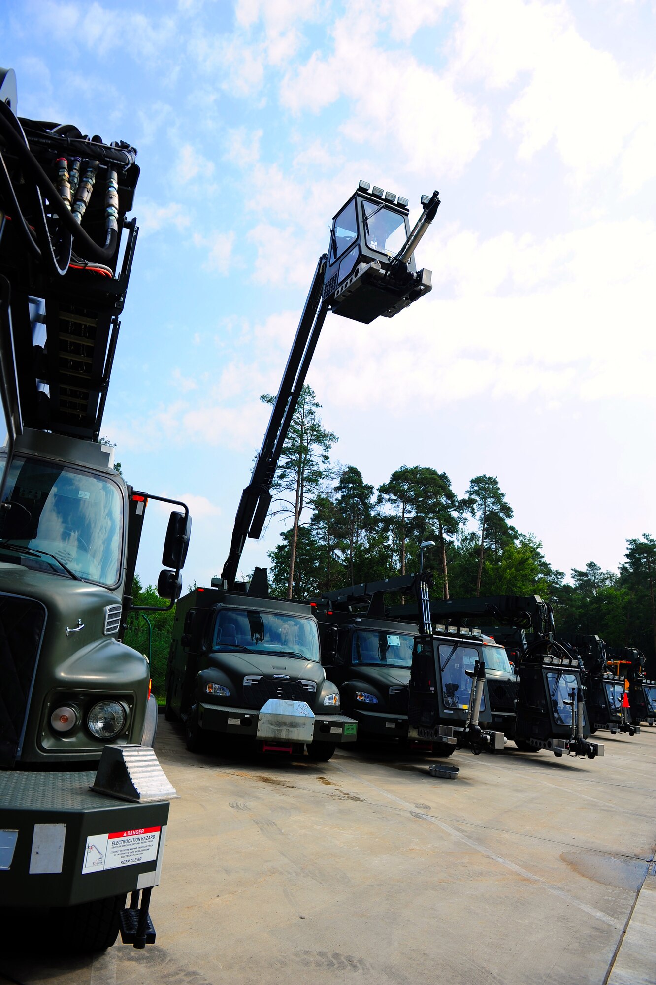 U.S. Air Force Airman 1st Class Seth Brady and Senior Airman Jeff Seastrand, 86th Vehicle Readiness Squadron special purpose snow team vehicle maintainers, perform a function check on an aircraft de-icer during the shop’s summer rebuild operations, Ramstein Air Base, Germany, Aug. 4, 2011. The 14-man team has five months to repair 35 vehicles before the winter; vehicles including aircraft de-icers, snow brooms, snow plows and salt spreaders. (U.S. Air Force Photo by Airman 1st Class Brea Miller)