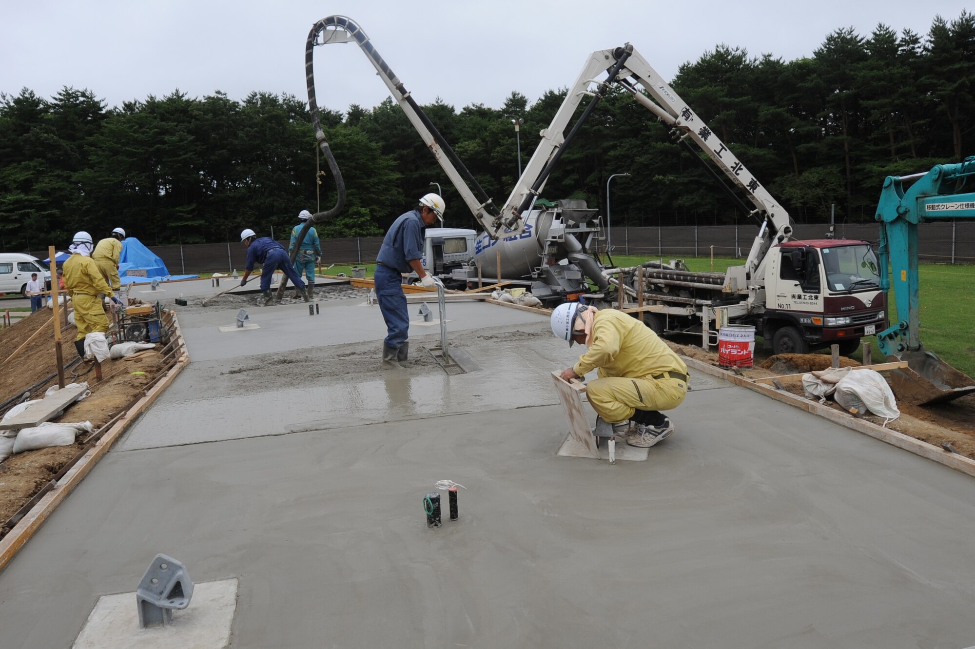 MISAWA AIR BASE, Japan -- Local Japanese contractors pour the cement antenna pad for Joint Tactical Ground Station Delta Detachment, 1st Space Company Aug. 2.  JTAGS is upgrading to new antennas to better the mission and provide accurate mission warnings. (U.S. Air Force photo/Staff Sgt. April Quintanilla)