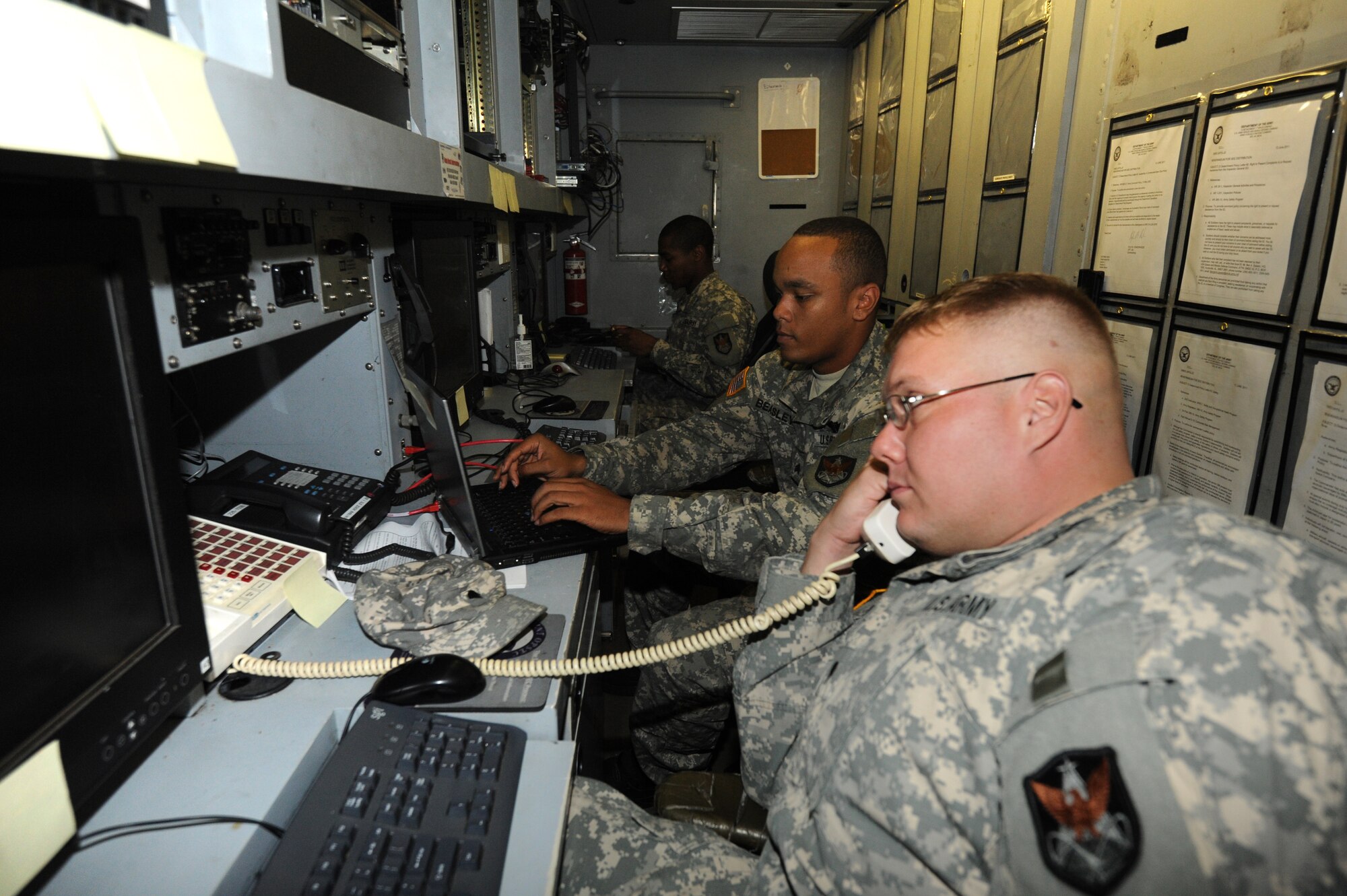 MISAWA AIR BASE, Japan -- U.S. Army Specialist Hans Heyer, front, and U.S. Army Sergeants Vyncent Beasley, center, and Ryon Powers, rear, Joint Tactical Ground Station Delta Detachment, 1st Space Company, perform mission operations Aug. 2.  The primary mission of JTAGS is providing ballistic missile warning and reporting.  (U.S. Air Force photo/Staff Sgt. April Quintanilla)