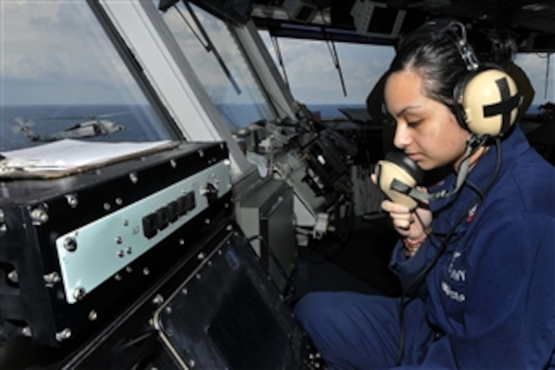 Petty Officer 2nd Class Natalia Grijalva mans a primary flight control system during flight operations aboard the aircraft carrier USS Ronald Reagan (CVN 76) in the Indian Ocean on Aug. 6, 2011.  The Ronald Reagan is underway in the U.S. 7th Fleet area of responsibility.  