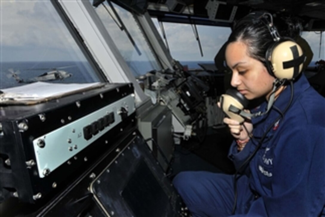 Petty Officer 2nd Class Natalia Grijalva mans a primary flight control system during flight operations aboard the aircraft carrier USS Ronald Reagan (CVN 76) in the Indian Ocean on Aug. 6, 2011.  The Ronald Reagan is underway in the U.S. 7th Fleet area of responsibility.  