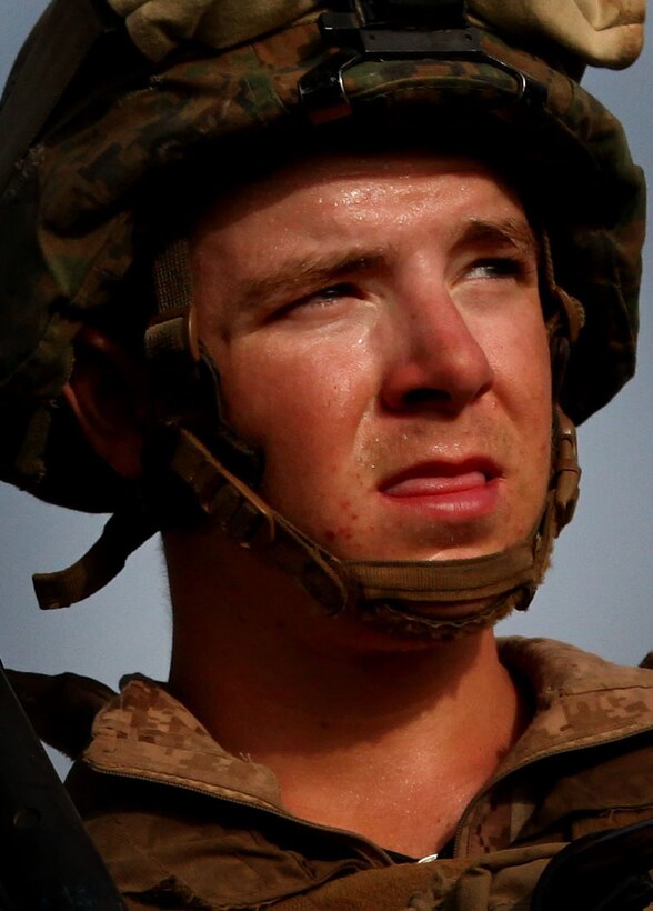 Hospital Apprentice Jesse Stephens, a native of Hartselle, Al., pauses to catch his breath after a firefight with insurgents in the Polpazai village, here, Aug. 11. The 19-year old Stephens, serves as a Navy corpsman with, 2nd Squad, 4th Platoon, Charlie Company, 1st Battalion, 6th Marine Regiment, and is on his first deployment.