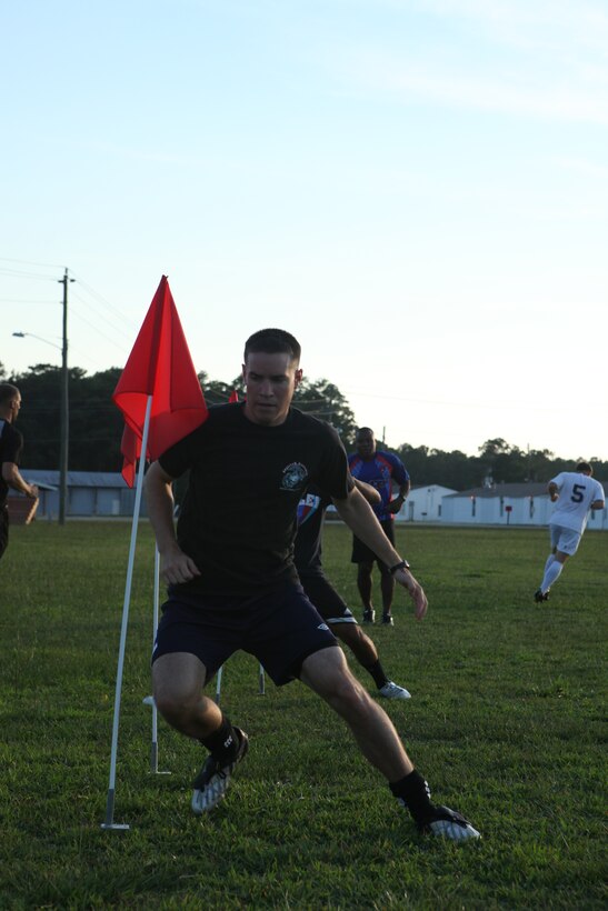 Marines and sailors perform the “in and out” agility drill during the Camp Lejeune Marines’ soccer tryouts at the soccer field aboard Camp Johnson, Aug. 10. The team, the official Marine Corps Base Camp Lejeune soccer team, will play in the Onslow Classic Soccer Association from September through November in a 12-game season, along with various tournaments.