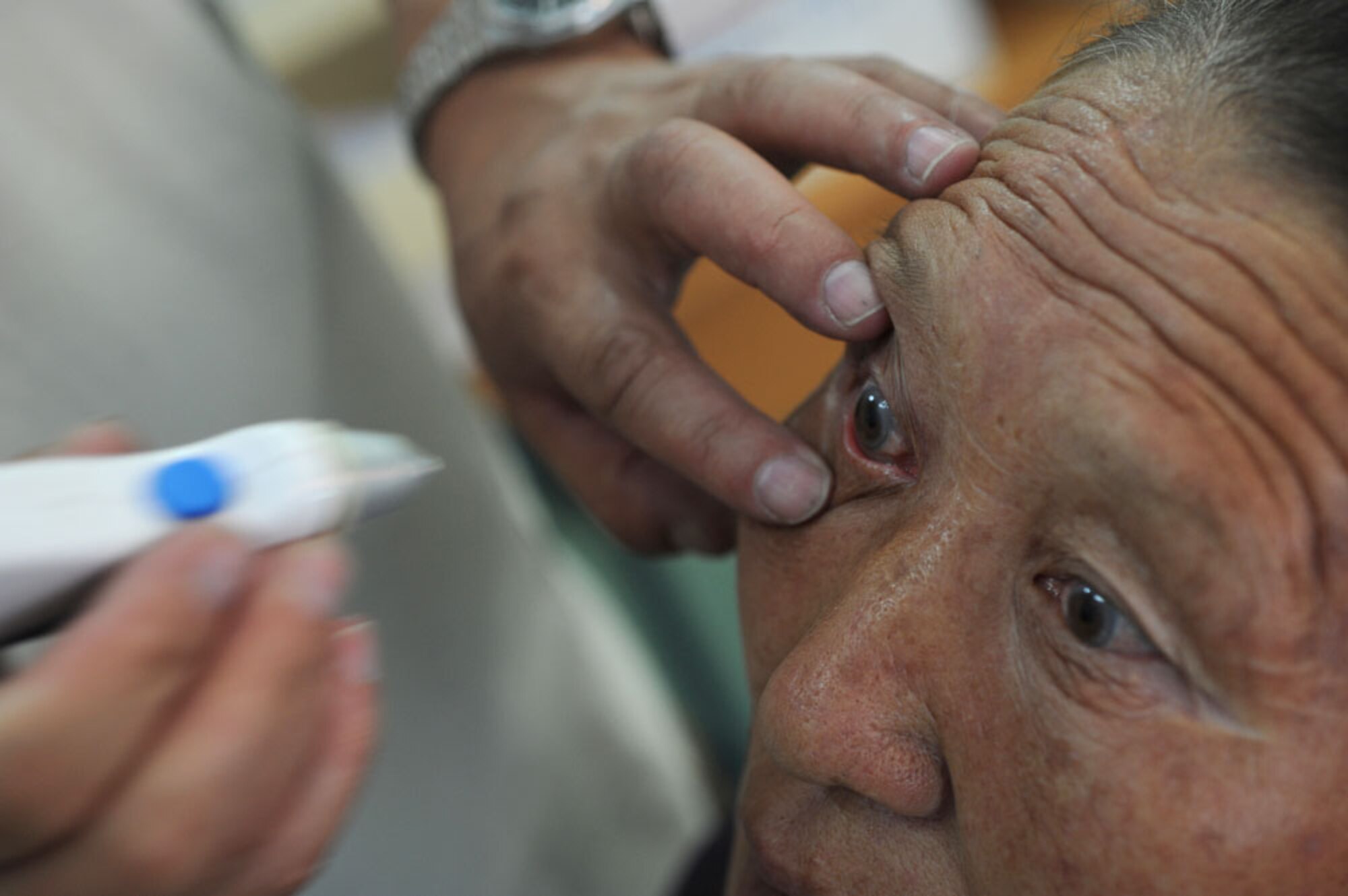 ULAANBAATAR, Mongolia – Mongolian Armed Forces Lt. Col Elbegjargal Buyantogtoich prepares to measure the cornea of an elderly Mongolian woman with a tonometer during a consultation at the Buynt Uhaa Complex in Ulaanbaatar, Mongolia on Aug. 9 during Khaan Quest 2011, a combined joint-exercise hosted by the Mongolian Armed Forces in partnership with U.S. Pacific Command forces. Medical Civil Action Programs like this enable the countries involved to become familiar with one another in addition to helping the community of the host country.  Khaan Quest officially started July 31 and continues until Aug 12. (U.S.  Air Force photo/Master Sgt. Cohen A. Young)