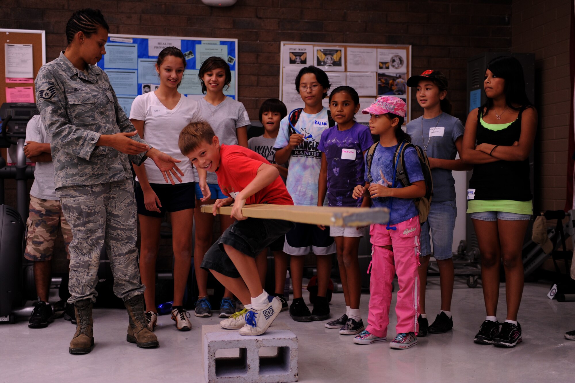 DAVIS-MONTHAN AIR FORCE BASE, Ariz. - Children of the local Tucson Community participates in a team-building exercise here Aug. 4 during an Arizona Operation Military Kids event. The event provides positive youth development opportunities for military youth that foster resilience during the deployment cycle.  (U.S. Air Force photo/Airman 1st Class Christine Halan)