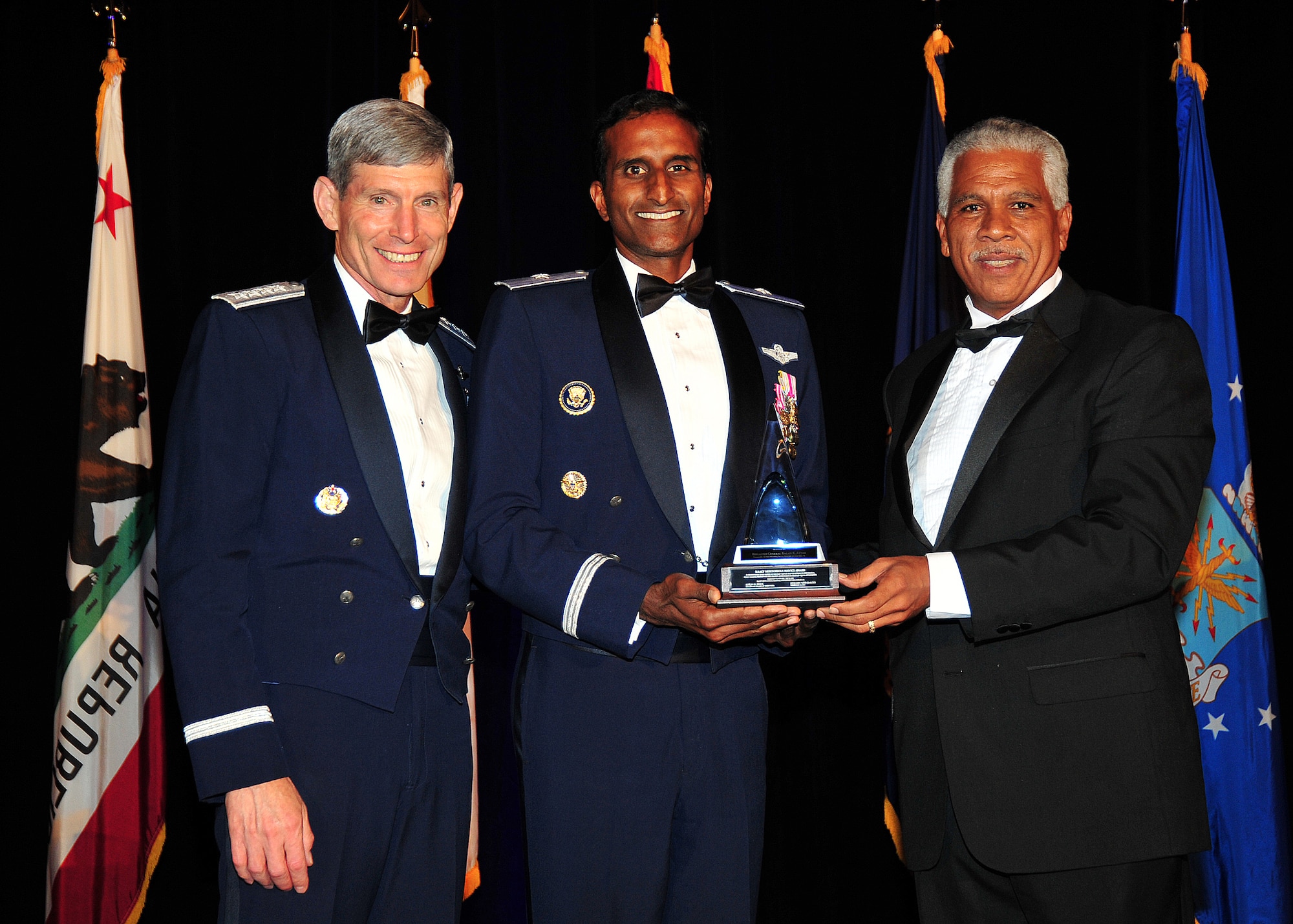 (Left to right) Air Force Chief of Staff Gen. Norton Schwartz; Brig. Gen. Balan R. Ayyar, Air Force Recruiting Service commander; and Hilary O. Shelton, NAACP Washington Bureau director and Senior Vice President for Advocacy, pose for a photo after Ayyar received the NAACP Meritorious Service Award July 26, 2011, in Los Angeles.  He received the award at the organization's Annual Armed Services and Veterans Affairs Awards Dinner, held in conjunction with the NAACP annual convention.  (U.S. Air Force Photo/Lou Hernandez)