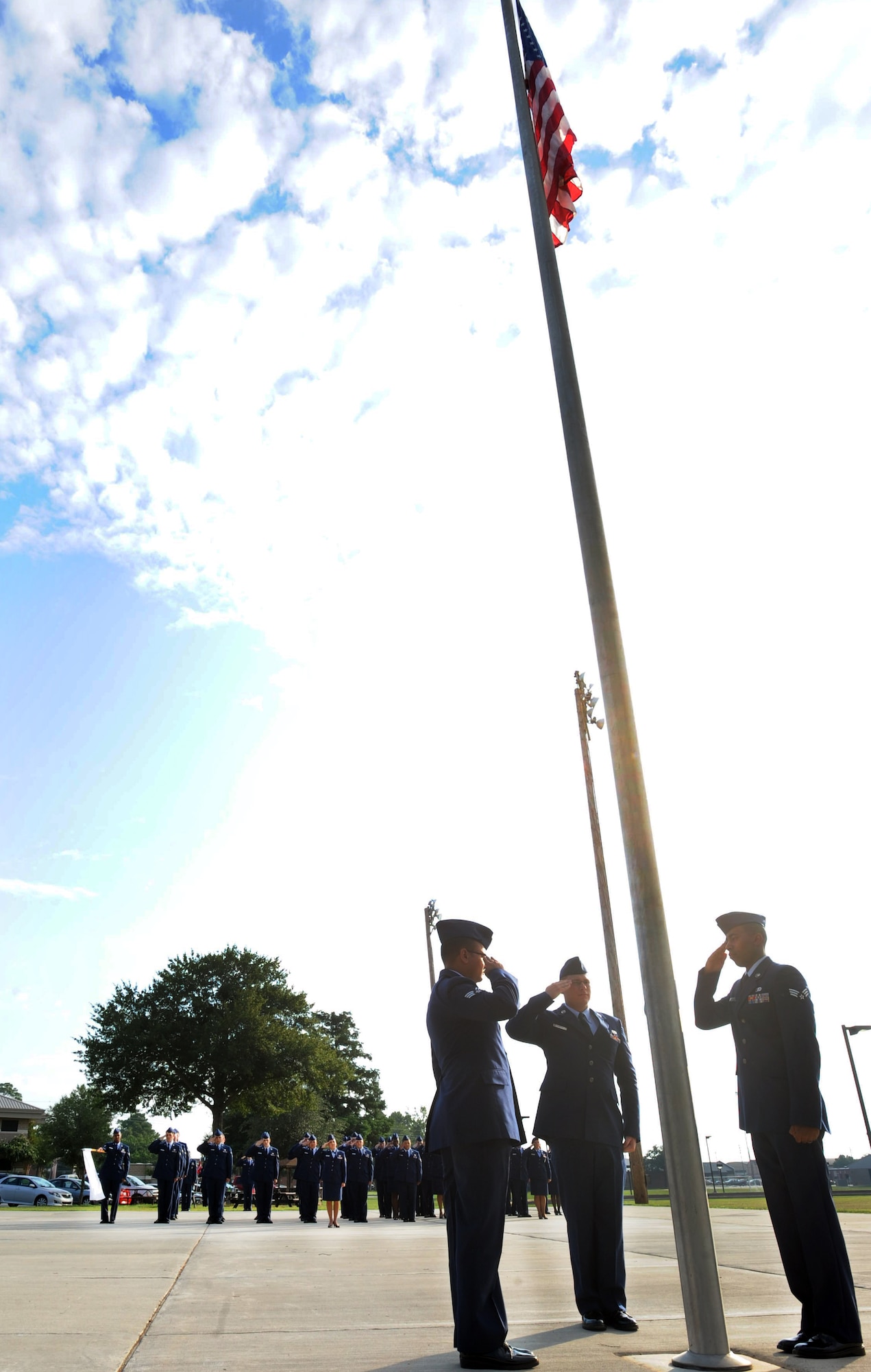 Airman Leadership School students salute the flag during reveille at Shaw Air Force Base, S.C. July 10, 2011. ALS is a five-week course designed to turn airmen into supervisors and focuses on leadership and leadership duties.  (U.S. Air Force photo/Airman 1st Class Tabatha L. Duarte)(Released)