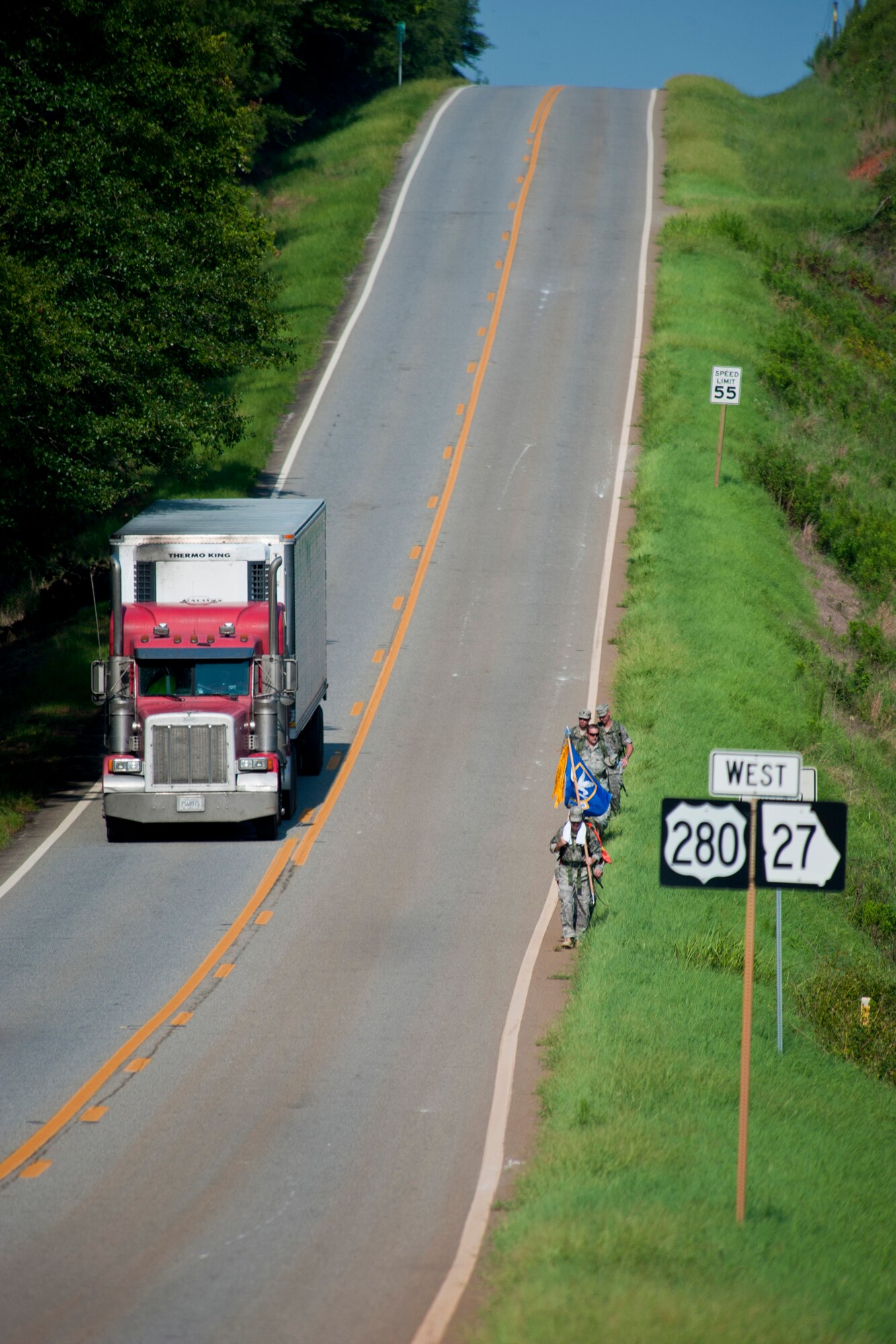 Members of the 23rd Security Forces Squadron and 336th Recruiting Squadron make their way down Highway 280 during Moody Air Force Base’s portion of the Ruck March to Remember Aug. 9, 2011, near Preston, Ga. The Ruck March to Remember began in Lackland Air Force Base, Texas, and is scheduled to end at ground zero in New York on Sept. 11. (U.S. Air Force photo by Staff Sgt. Jamal D. Sutter/Released)