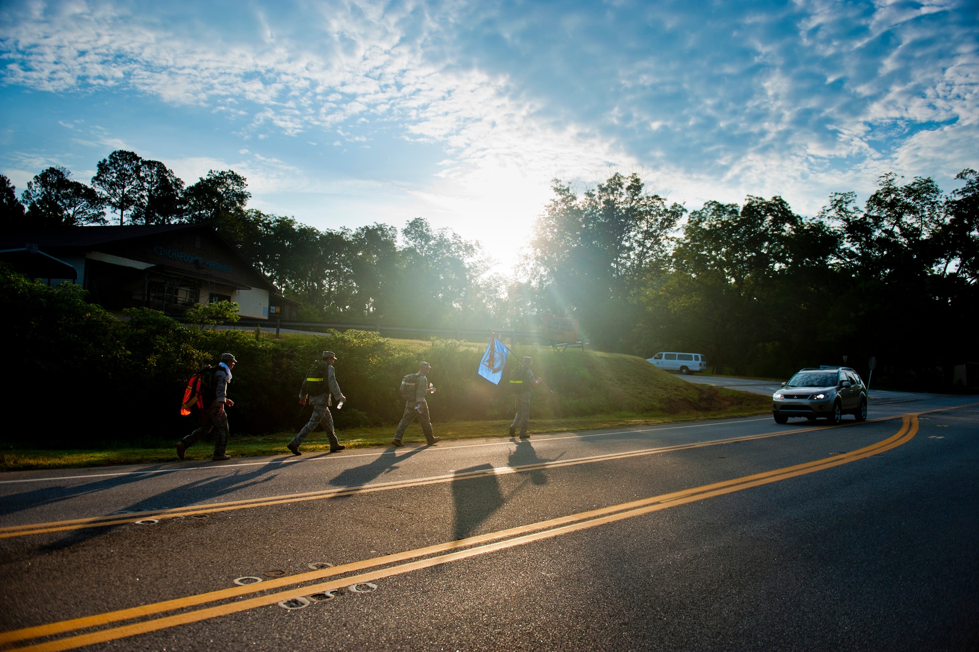 Members of the 23rd Security Forces Squadron and 336th Recruiting Squadron make their way down Highway 280 during Moody Air Force Base’s portion of the Ruck March to Remember Aug. 9, 2011, near Preston, Ga. The 820th Base Defense Group is scheduled to begin another leg of the march for Moody Aug. 13. (U.S. Air Force photo by Staff Sgt. Jamal D. Sutter/Released)