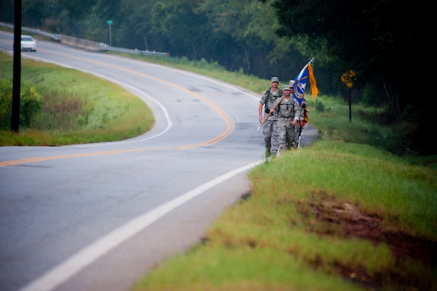 Members of the 23rd Security Forces Squadron and 336th Recruiting Squadron make their way down Highway 280 during Moody Air Force Base’s portion of the Ruck March to Remember Aug. 9, 2011, in Richland, Ga. Moody’s portion of the 2,181-mile march began Aug. 5 in Brantley, Ala., and ended Aug. 9 in Plains, Ga., covering 143 miles. (U.S. Air Force photo by Staff Sgt. Jamal D. Sutter/Released)