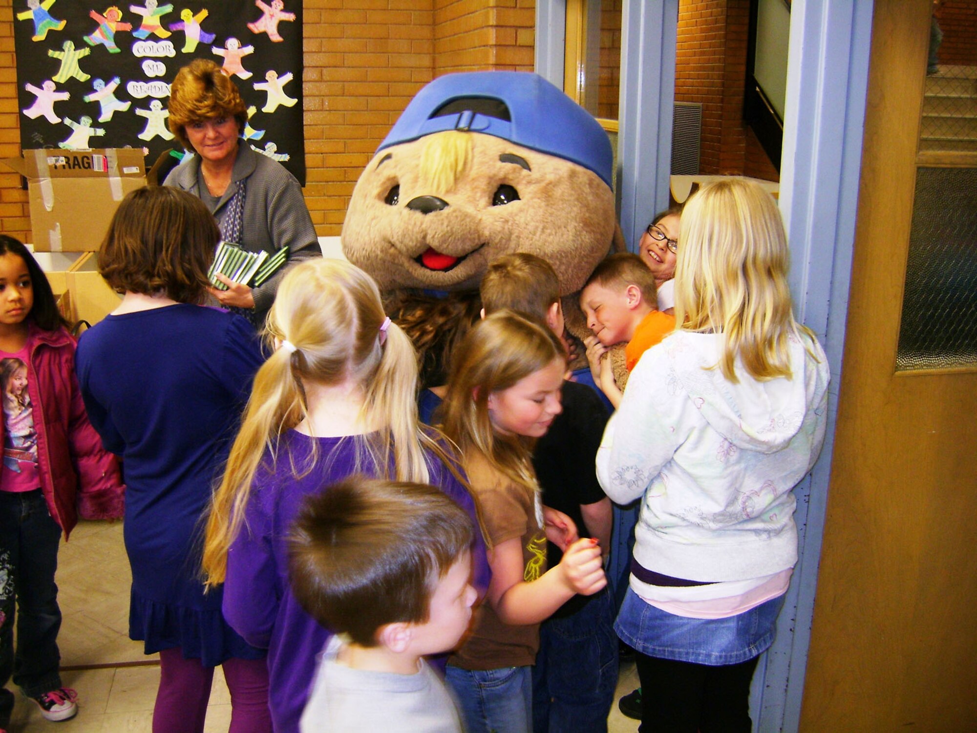 Sammy Rabbit greets kids after a recent show. Author Sam Renick and his “Sammy Rabbit” children’s book character will be coming to Hanscom Aug. 19 to teach children tips about finances. (Courtesy photo)