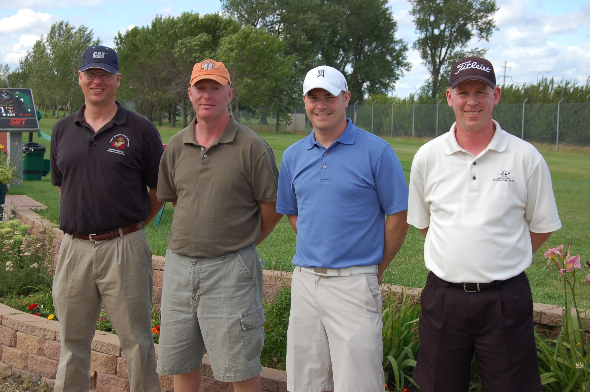 MINOT AIR FORCE BASE, N.D. -- Col. Steve Williams, 91st Maintenance Group commander (far left), Master Sgt. Joseph Haddox, 5th Bomb Wing nuclear surety manager (left), Mr. David Buen and Mr. Reed Argent were named the winners of the Minot Area Council's Golf Scramble at the Roughrider golf course here Aug. 8. Events like this promote stronger community relations between base leadership and civic leaders of Team Minot. (Courtesy photo)
