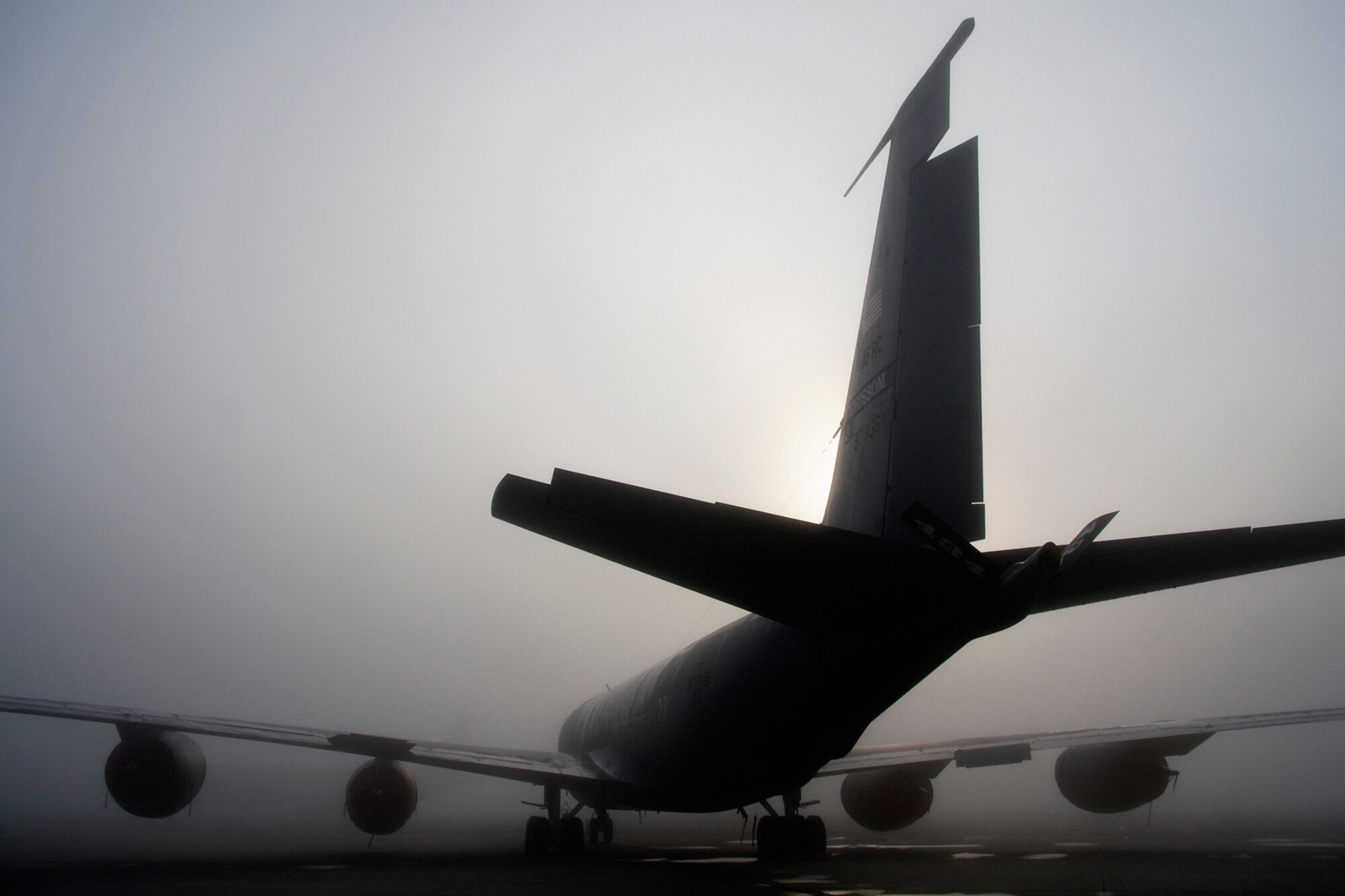 GRISSSOM AIR RESERVE BASE, Ind. -- Surrounded by a dense fog, a KC-135R Stratotanker at Grissom sits on the flight line Aug. 7. Sixteen KC-135s are assigned to the 434th Air Refueling Wing at Grissom, making it the largest Stratotanker unit in the Air Force Reserve. Four turbofans, mounted under 35-degree swept wings, power the KC-135 to takeoffs at gross weights up to 322,500 pounds. Nearly all internal fuel can be pumped through the flying boom, the KC-135's primary fuel transfer method. (U.S. Air Force photo/Tech. Sgt. Mark R. W. Orders-Woempner)

