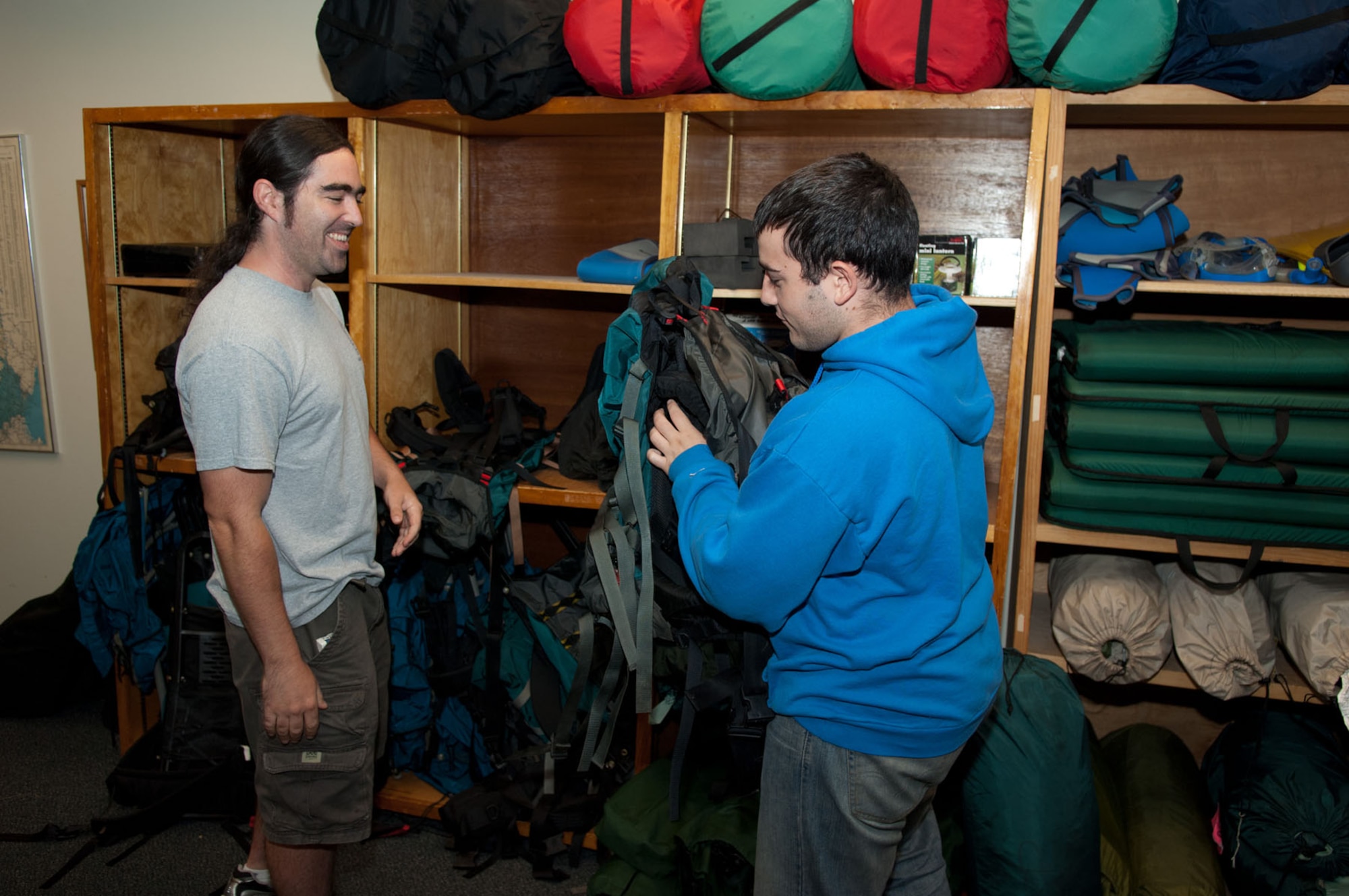 HANSCOM AIR FORCE BASE, Mass. – Brad Lavoie (right), Outdoor Recreation aid, helps a customer with camping equipment in Building 1530 Aug. 10. Outdoor recreation has a wide range of sporting, camping, boating and party equipment that the Hanscom community can rent. Visit the Hanscom Services website for more details (U.S. Air Force photo by Rick Berry)