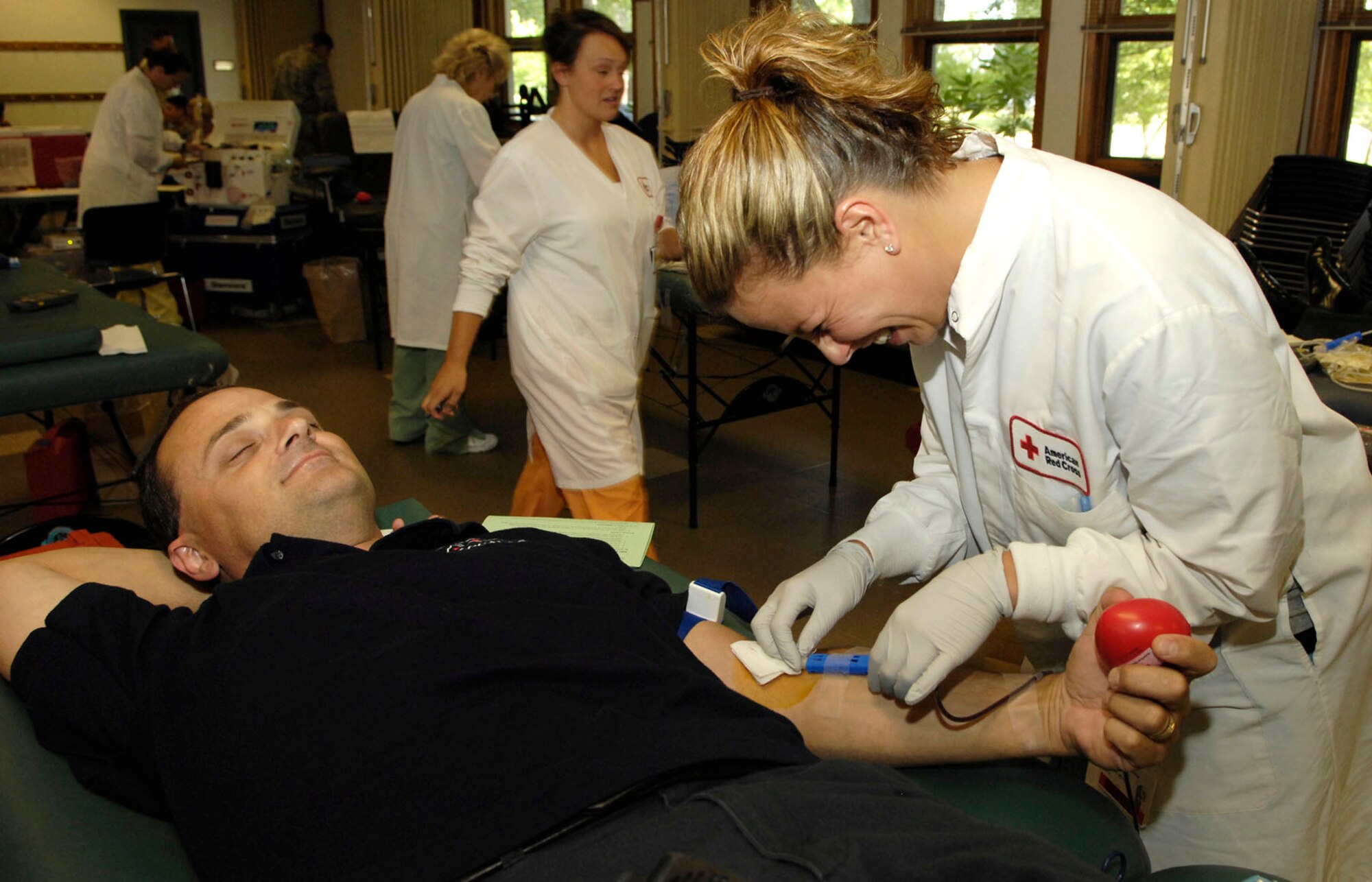 HANSCOM AIR FORCE BASE, Mass. - Nurse Michelle Naylor draws blood from Todd Grierson’s arm during the base blood drive at the chapel Aug. 9. Members of the American Red Cross came to the base to help fill a critical blood supply need. (U.S. Air Force photo)
