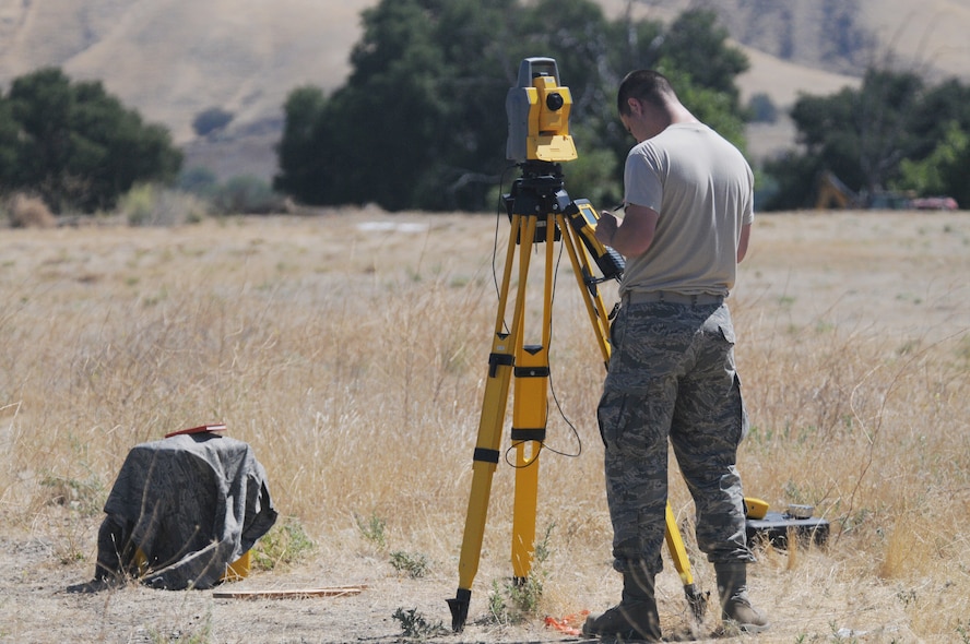 Staff Sgt. Tyler Davis, suveyor with the 126th Civil Engineering Squadron, checks information on a Trimble Total Station as his team does a topographical survey. The Illiinois Air National Guard unit is assisting the California Army National Guard in renovations at Camp Roberts, Cali. The Army National Guard training base was created in 1941 to support troops leaving for World War II and is now in need of repairs to buildings and infrastructure. Air National Guard Civil Engineering squadrons are using the opportunity to train on real world electrical, structural, plumbing and heavy equipment scenarios. This creates a  collaboration that proves valuable to both National Guard components. (U.S. Air Force photo by Master Sgt. Ken Stephens)