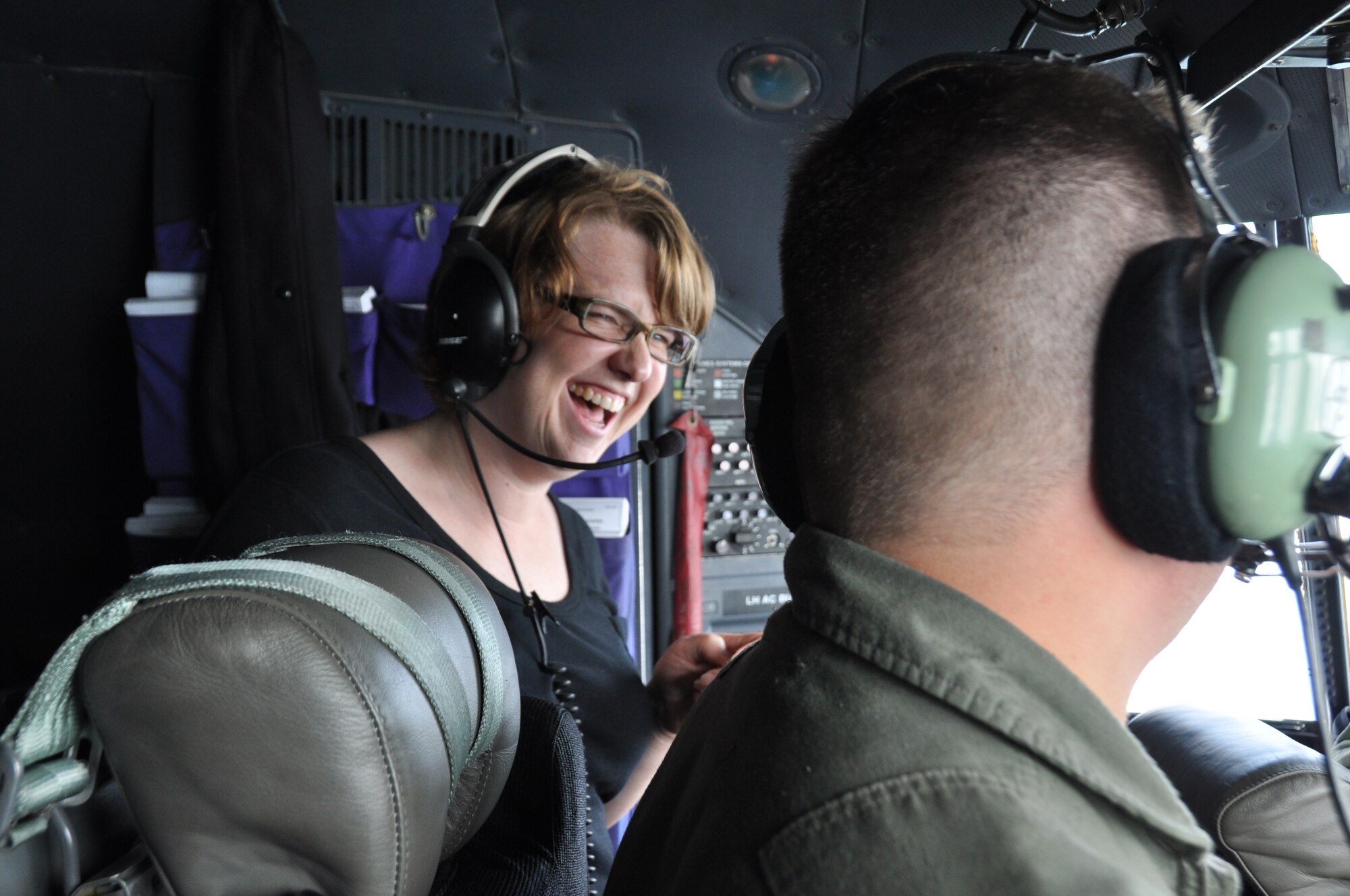 Caroline Leab, Product Quality Assurance Manager for AGA Medical, enjoys the cockpit view from the C-130 during Employers Day Aug. 6. (Air Force photo/Staff Sgt. Kim Hickey).
