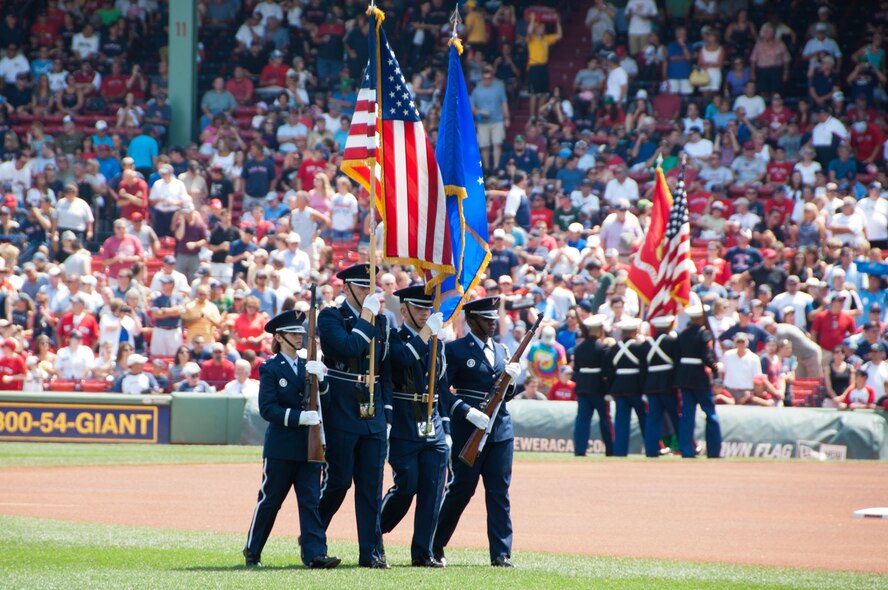 BOSTON – Patriot Honor Guard members march off the field after presenting the colors during the national anthem before a military appreciation game at Fenway Park July 28. In addition to representing the Air Force at sporting events, honor guard members are present at military funerals, retirements, change of commands, official military functions and numerous other ceremonies and parades. (U.S. Air Force photo by Rick Berry)