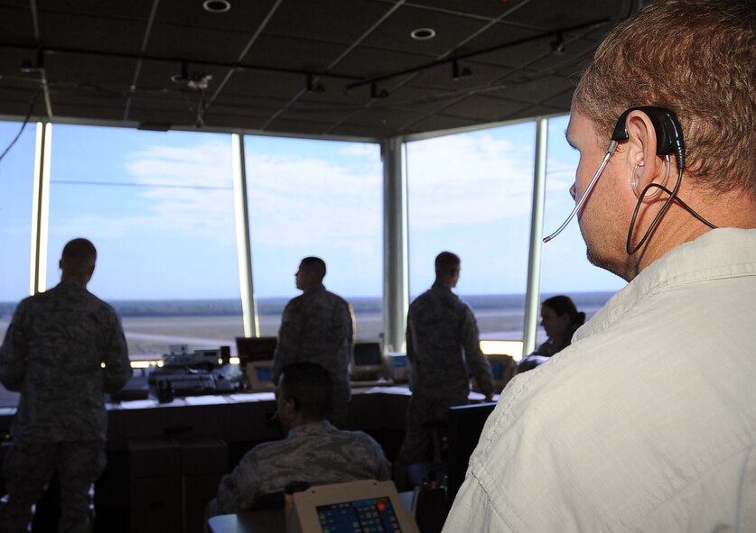 Mark Whipple, 2nd Operations Squadron watch supervisor, supervises the air traffic controllers as aircraft enter and exit the runway on Barksdale Air Force Base, La., Aug. 9. The tower averages more than 30 operations over a 24-hour period and is manned seven days a week. (U.S. Air Force photo/Senior Airman Amber Ashcraft) (RELEASED)