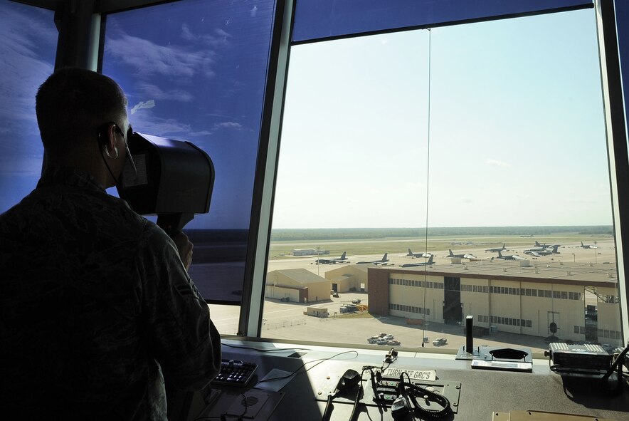 Airman 1st Class Michael Tscheschlog, 2nd Operations Squadron air traffic controller, demonstrates how to use a light gun on Barksdale Air Force Base, La., Aug. 9. The light gun is used to direct aircraft if radio communications are lost. The tower averages more than 30 operations over a 24-hour period and is manned seven days a week. (U.S. Air Force photo/Senior Airman Amber Ashcraft) (RELEASED)

