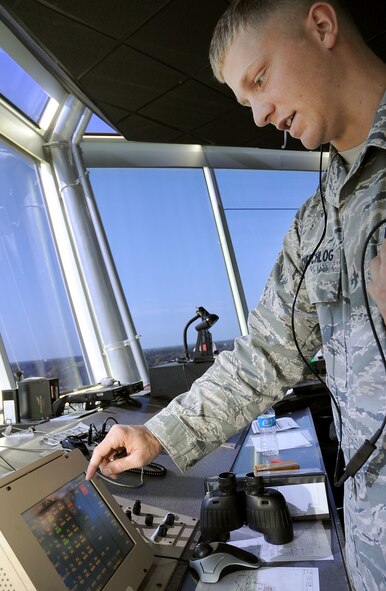 Airman 1st Class Michael Tscheschlog, 2nd Operations Squadron air traffic controller, communicates with a B-52 pilot taxiing on the runway of Barksdale Air Force Base, La., Aug. 9. The tower has at least four air traffic controllers  on shift at all times, including the local controller, flight data, ground controller and the watch supervisor. More than 30 operations are run per day and the tower is manned 24/7. (U.S. Air Force photo/Senior Airman Amber Ashcraft) (RELEASED)
