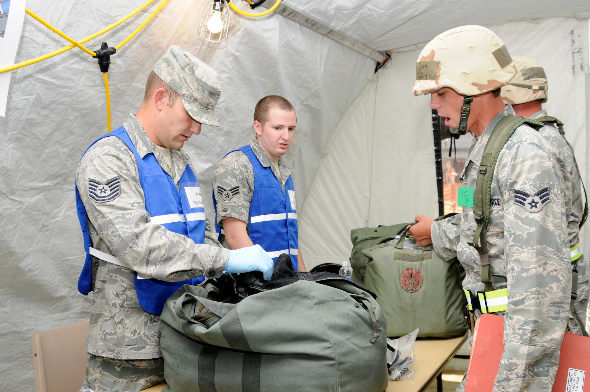 Members of the 188th Fighter Wing participate in an Air Combat Command Phase I Operational Readiness Inspection. Each deploying Airmen must have their mobility baggage checked before deploying during the inspection. (U.S. Air Force photo by Amn. Hannah Landeros/188th Fighter Wing Public Affairs) 