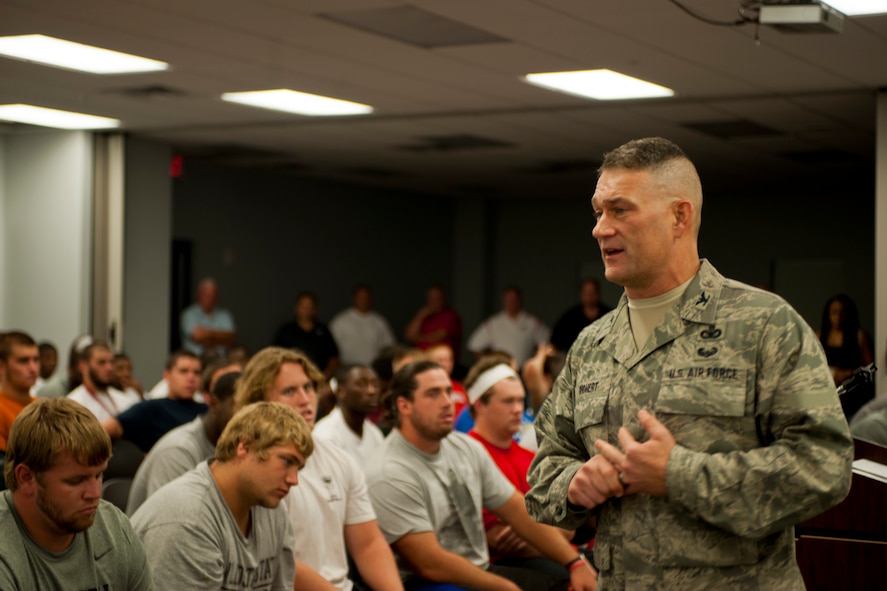 U.S. Air Force Col. Randall Richert, 820th Base Defense Group commander, addresses more than 100 members of the Valdosta State University football team during their first team meeting in Valdosta, Ga., Aug. 7, 2011. VSU coach David Dean invited Richert to talk to the players because of his past as football coach and experiences leading battlefield Airmen. (U.S. Air Force photo by Andrea Thacker/Released)