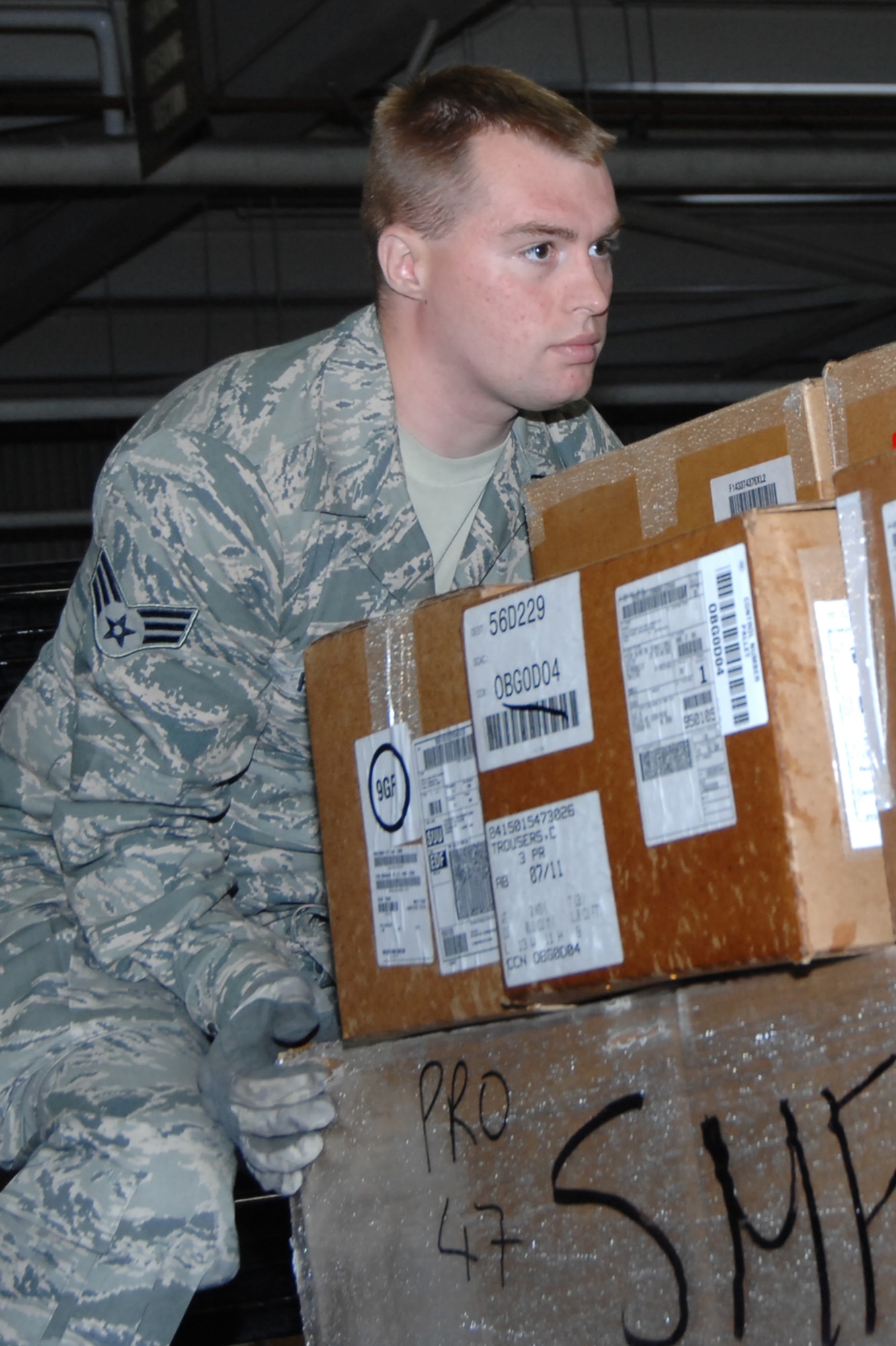 Senior Airman Burke Hyde, a traffic management specialist for the 127th Logistics Readiness Squadron, transfers a paletted shipment for the 673rd Logistics Readiness Squadron of Elmendorf, Alaska. Approximately 40 Airmen from the 127th LRS spent their two weeks of annual training integrated with the active duty and guard personnel of Joint Base Elmendorf/Ft. Richardson (JBER), where they accomplished core task training, and shared knowledge and skills with their counterparts. The 127th LRS is part of the Michigan Air National Guard. (USAF Photo by SSgt. Rachel Barton)