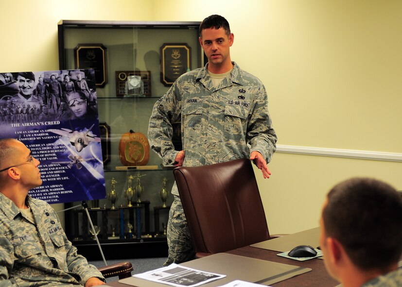 Tech. Sgt. Ray Grogan, 20th Contracting Squadron acquisition team lead, addresses his team in the conference room at Shaw Air Force Base, S.C. Aug. 10, 2011. He is the Warrior of the Week for the week of August 8 through 12. (U.S. Air Force photo/Airman 1st Class Daniel Phelps)(Released)