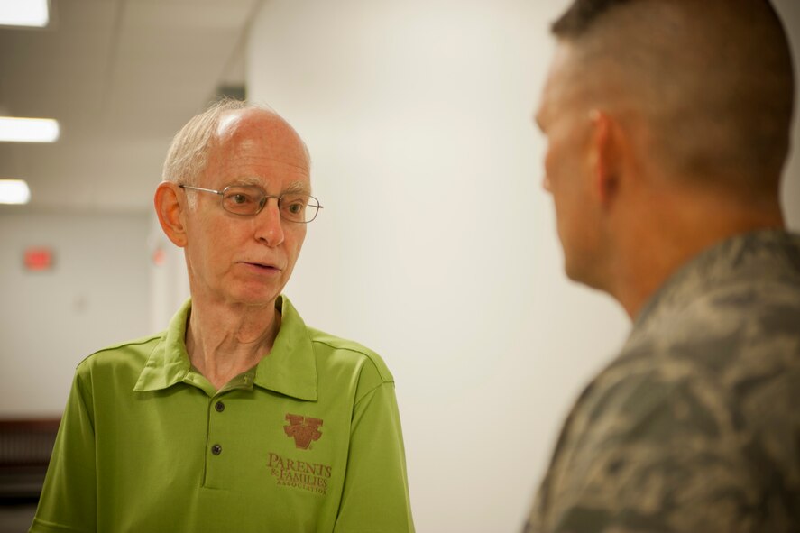 Valdosta State University Interim President Louis Levy thanks the commander of the 820th Base Defense Group, U.S. Air Force Col. Randall Richert, for his service and for volunteering his time to speak to the VSU football team during a team meeting in the VSU Athletic Field House in Valdosta, Ga., Aug. 7, 2011. VSU coach David Dean asked Richert to give a motivational speech to the players because of his football background and leadership experiences. (U.S. Air Force photo by Andrea Thacker/Released)