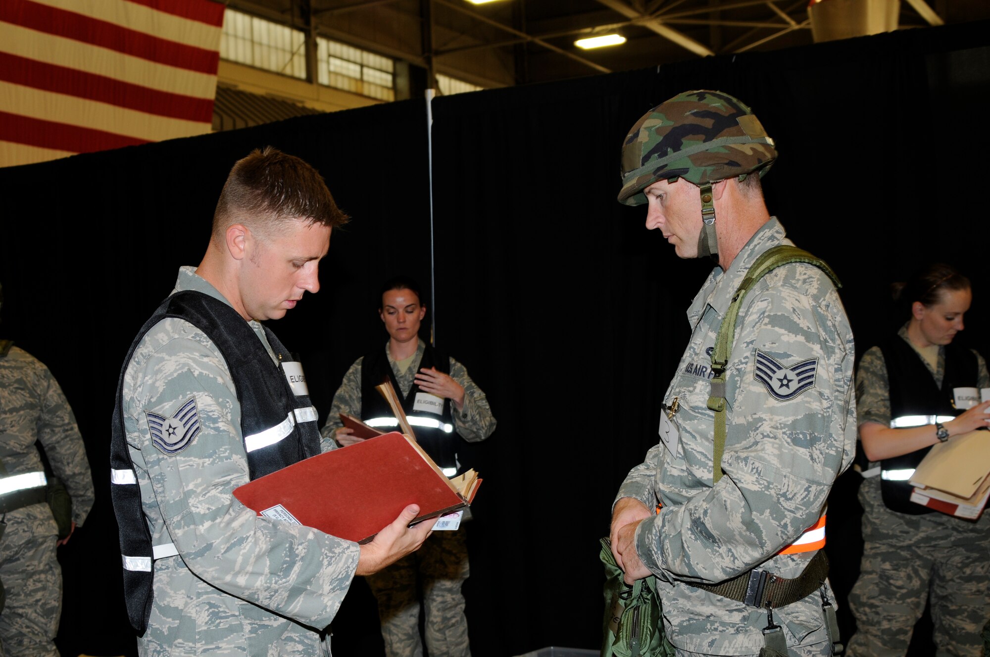 Tech Sgt. Eric Martin, left, reviews a personnel folder during an Air Combat Command Phase I Operational Readiness Inspection. (U.S. Air Force photo by Amn. Hannah Landeros/188th Fighter Wing Public Affairs)
