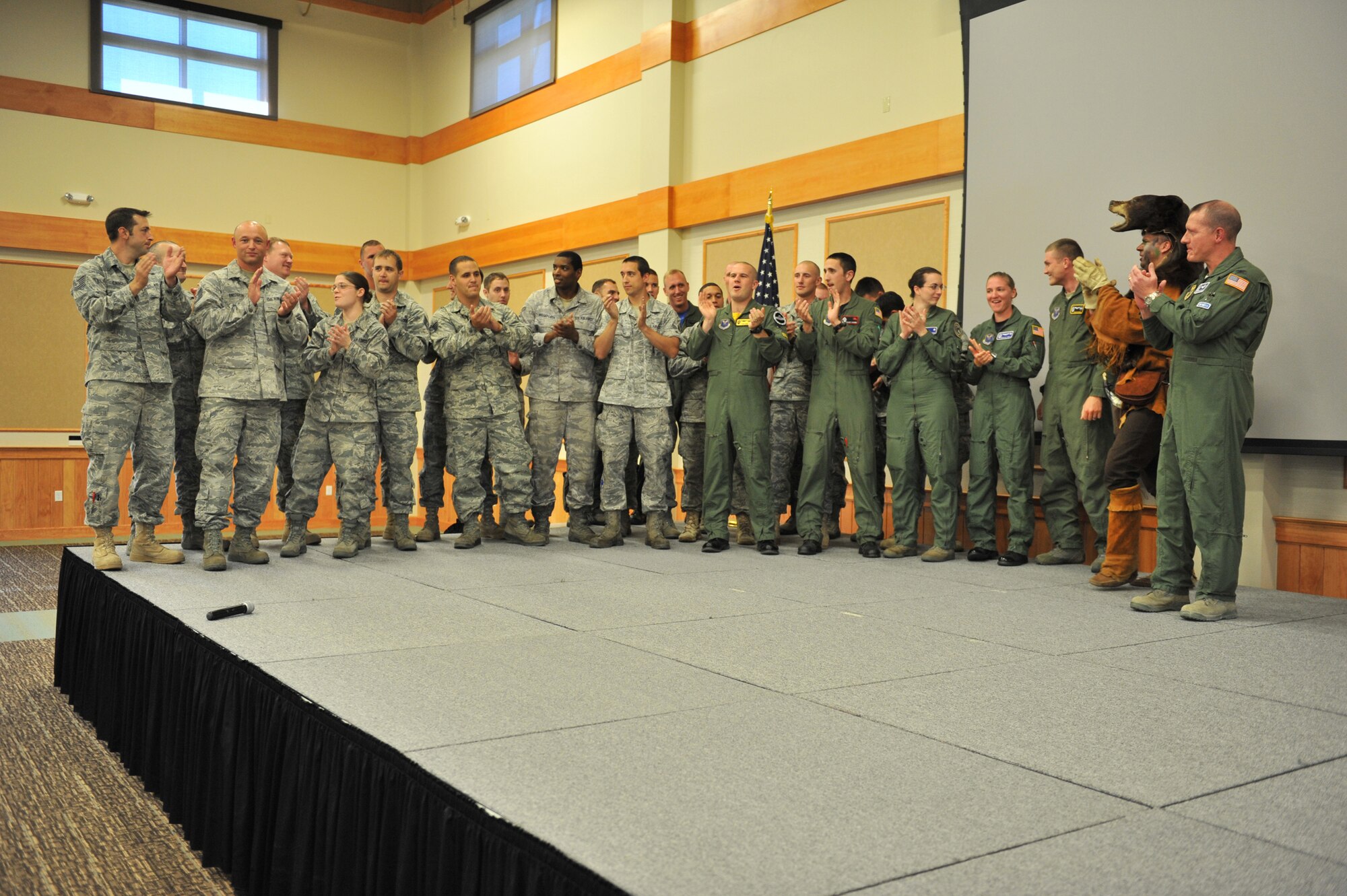 Members of the 341st Missile Wing Global Strike Challenge team applaud after the announcement of Malmstrom's 2011 competitors at the Grizzly Bend Club July 29.  (U.S. Air Force photo/John Turner)