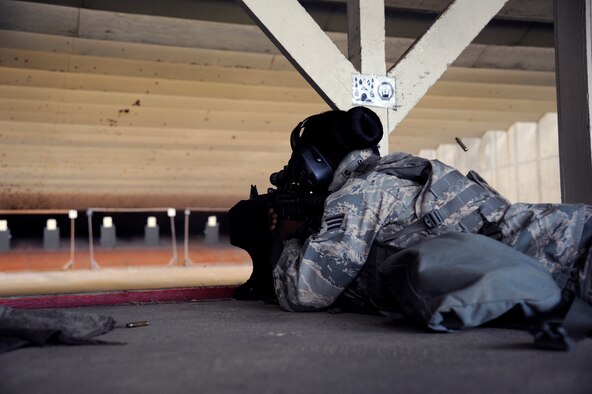 WHITEMAN AIR FORCE BASE, Mo. - Senior Airman Vanessa Reedtacla , 509th Security Forces Squadron, shoots at the firing range here July 28, 2011 during M4 Carbine qualification firing. Airmen must shoot 32 of 50 targets to pass proficiently, but 43 of 50 targets are required for Airmen be considered an expert marksman. (U.S. Air Force photo by Airman 1st Class Cody H. Ramirez)
