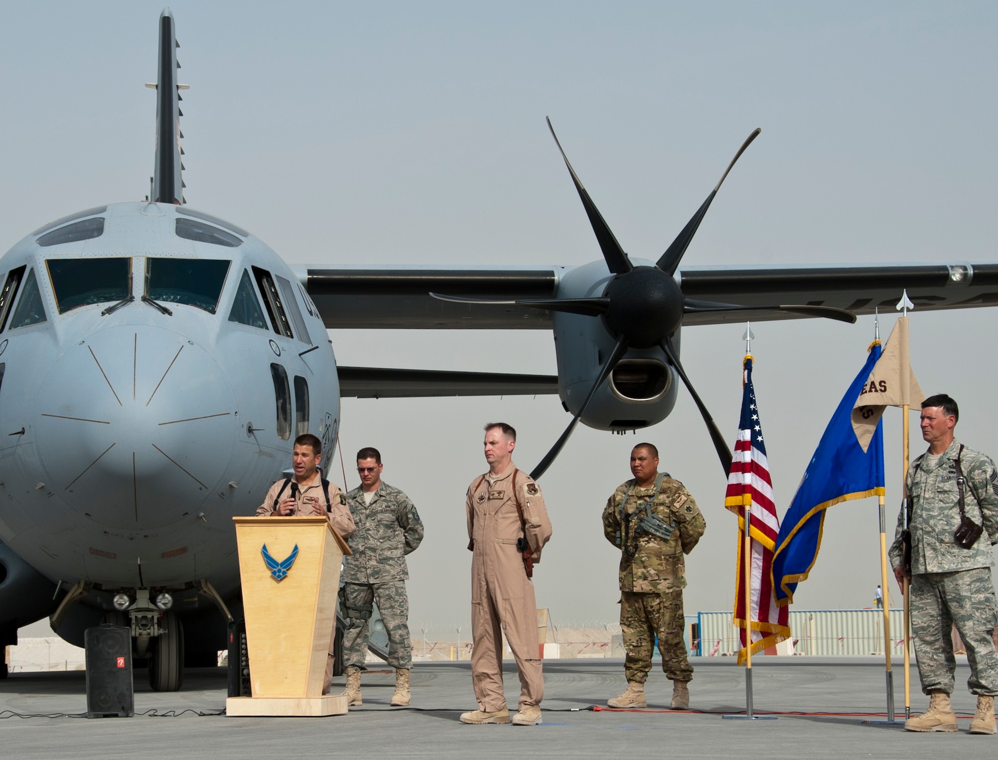 KANDAHAR AIRFIELD, Afghanistan  --  Lt. Col. Robert Schuett speaks to the attendees of the 702nd Expeditionary Airlift Squadron assumption of command here Aug. 9, 2011. The 702nd EAS is a tactical transport squadron, made up of Army and Air Force Guard flying C-27J Spartans to provide support to Forward Operating Bases. The squadron stood up here July 31. (U.S. Air Force photo by Senior Airman David Carbajal/Released)