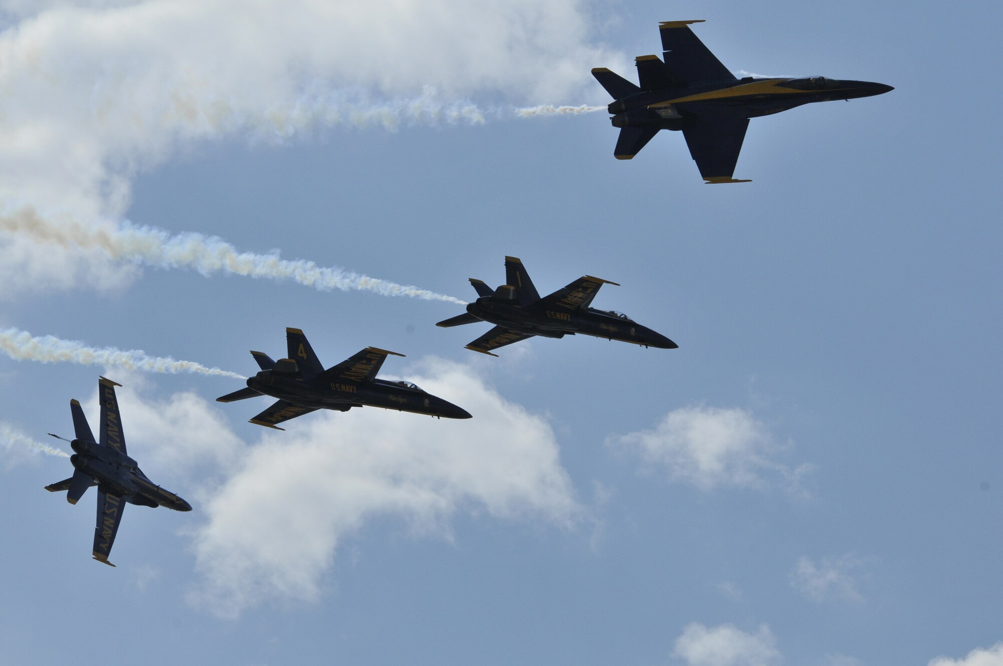The U.S. Navy's Blue Angels F/A-18 Hornets perform a formation separation during the air show July 30.  Their highly anticipated performance closed the aerial performances on July 30 and 31.  (U.S. Air Force photo/John Turner) 