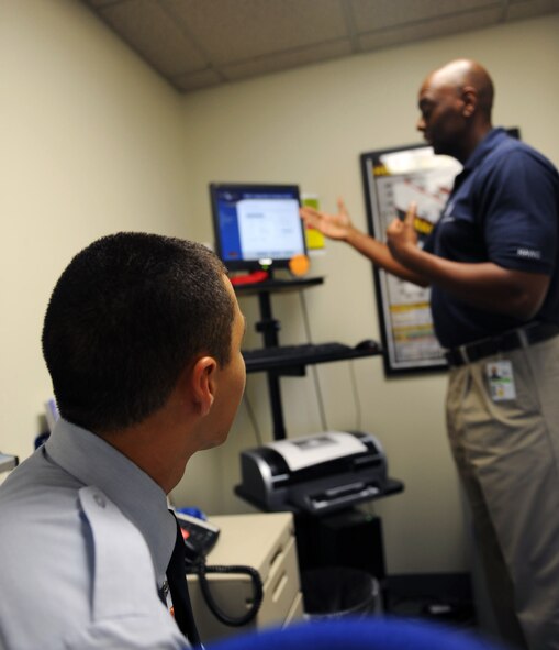 U.S. Air Force Tech. Sgt. Lawrence Black, 20th Aerospace Medical Squadron health fitness technician, assesses Airman 1st Class Romaldo Vasquez, 20th Fighter Wing knowledge operations management, at the Health and Wellness Center, Shaw Air Force Base, S.C. August 8, 2011. The BOD POD measures body fat percentage by using air displacement and it measures the metabolic rate. This is one of the many services the HAWC offers free to military ID cardholders. (U.S. Air Force photo/Airman 1st Class Tabatha L. Duarte)(Released)