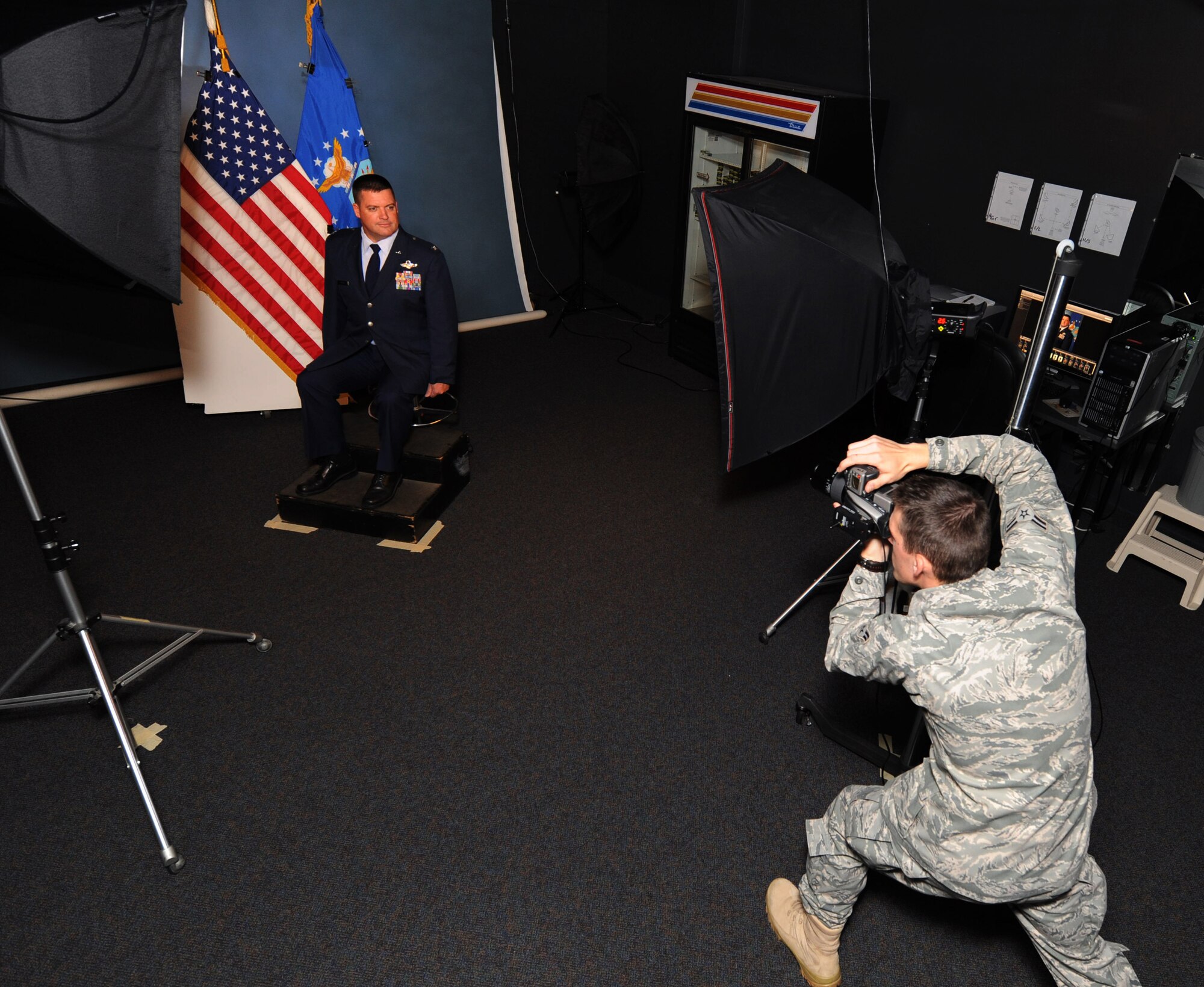 U.S. Air Force Airman 1st Class Neil Warner, 20th Fighter Wing Public Affairs basic still photographer, takes a studio picture of Col. Donovan Godier, 20th Fighter Wing vice commander, Shaw Air Force Base, S.C. August 9, 2011. Public Affairs Airmen get their opportunity to tell the Air Force's story by highlighting Airmen of all ranks and career fields. (U.S. Air Force photo/Airman 1st Class Tabatha L. Duarte)(Released)