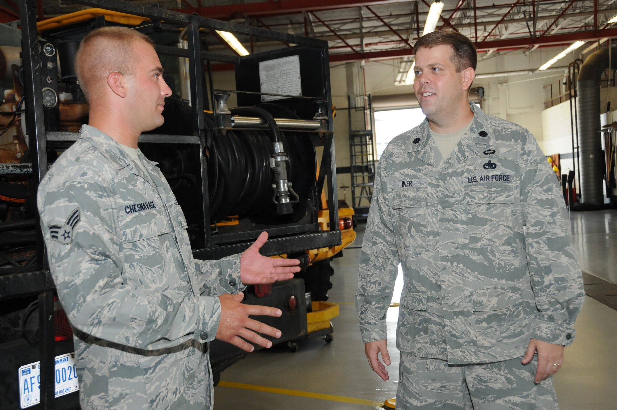 Senior Airman Matthew Chesnavage, left, 81st Logistics Readiness Squadron, gives Lt. Col. Duff Weir, the squadron’s new commander, a tour of the vehicle maintenance shop. Wier comes to Keesler from Buckley Air Force Base, Colo. where he was commander of the 460th LRS and deputy commander of the 460th Mission Support Group. After two years, Lt. Col. Robert Hicks relinquished command of the 81st LRS July 26 and serves as chief of the logistics operations division at Fort Eustis, Va.  (U.S. Air Force photo by Kemberly Groue)
