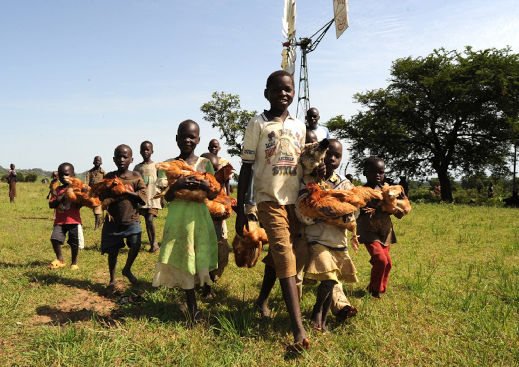 Children deliver their chickens for inoculations with U.S. Army veterinarians from Combined Joint Task Force Horn of Africa during a mission in the remote Karamoja region of Uganda. (U.S. Air Force Photo/Master Sgt Dawn Price)