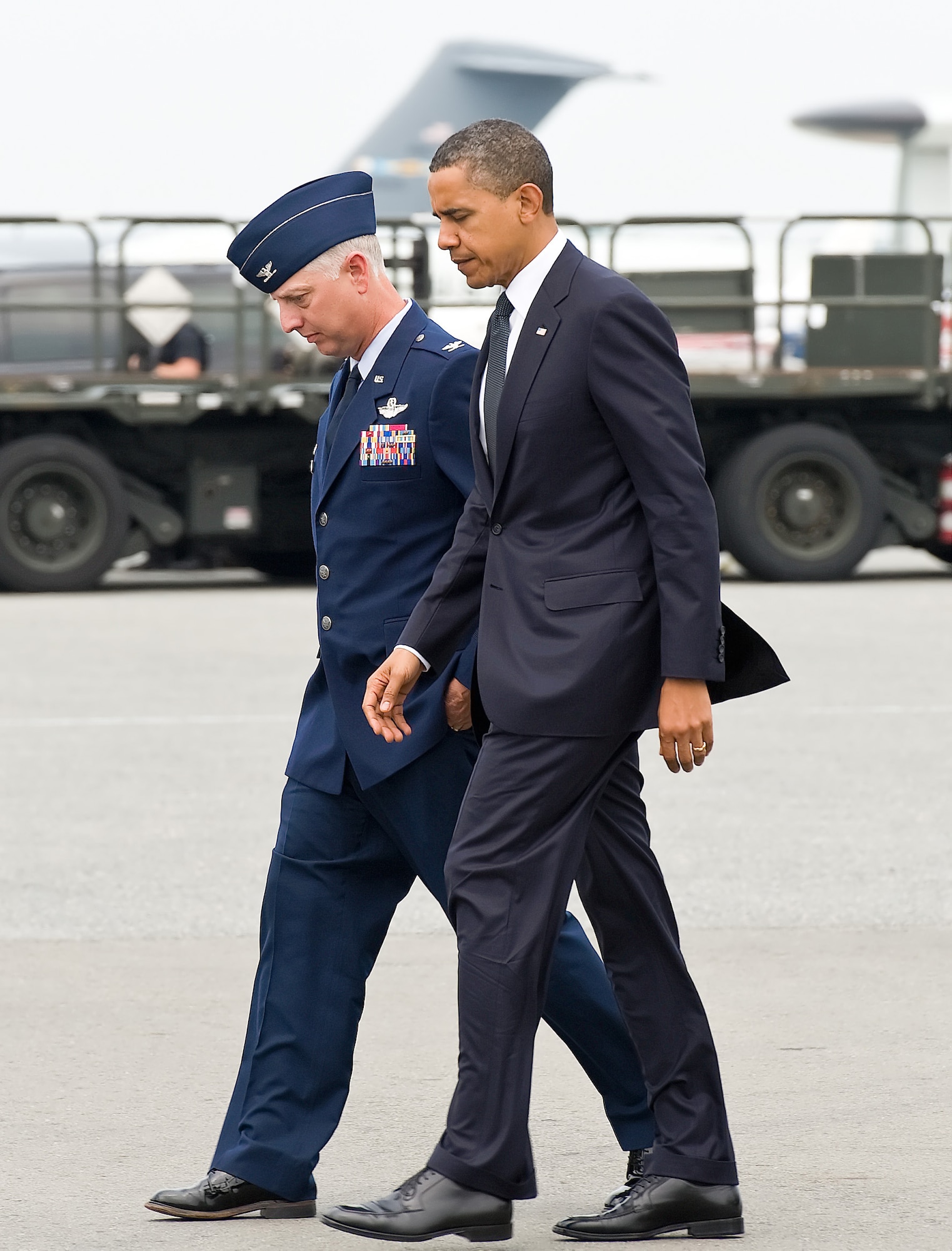 President Barack Obama is escorted by Col. Mark Camerer, 436th Airlift Wing commander at Dover Air Force Base, Del., Aug. 9, 2011. The president came to Dover to pay respect to 30 fallen U.S. servicemembers, seven Afghan soldiers and a civilian interpreter at a dignified transfer. (U.S. Air Force photo/Roland Balik)