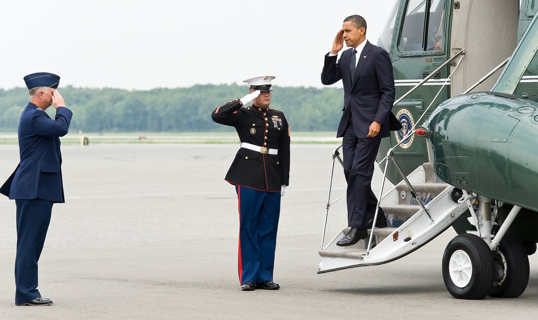Col. Mark Camerer, commander of the 436th Airlift Wing, salutes President Barack Obama as he steps off Marine One at Dover Air Force Base, Del., Aug. 9, 2011. Obama came to Dover to pay respect to 30 fallen U.S. servicemembers, seven Afghan soldiers and a civilian interpreter at a dignified transfer. (U.S. Air Force photo/Roland Balik)
