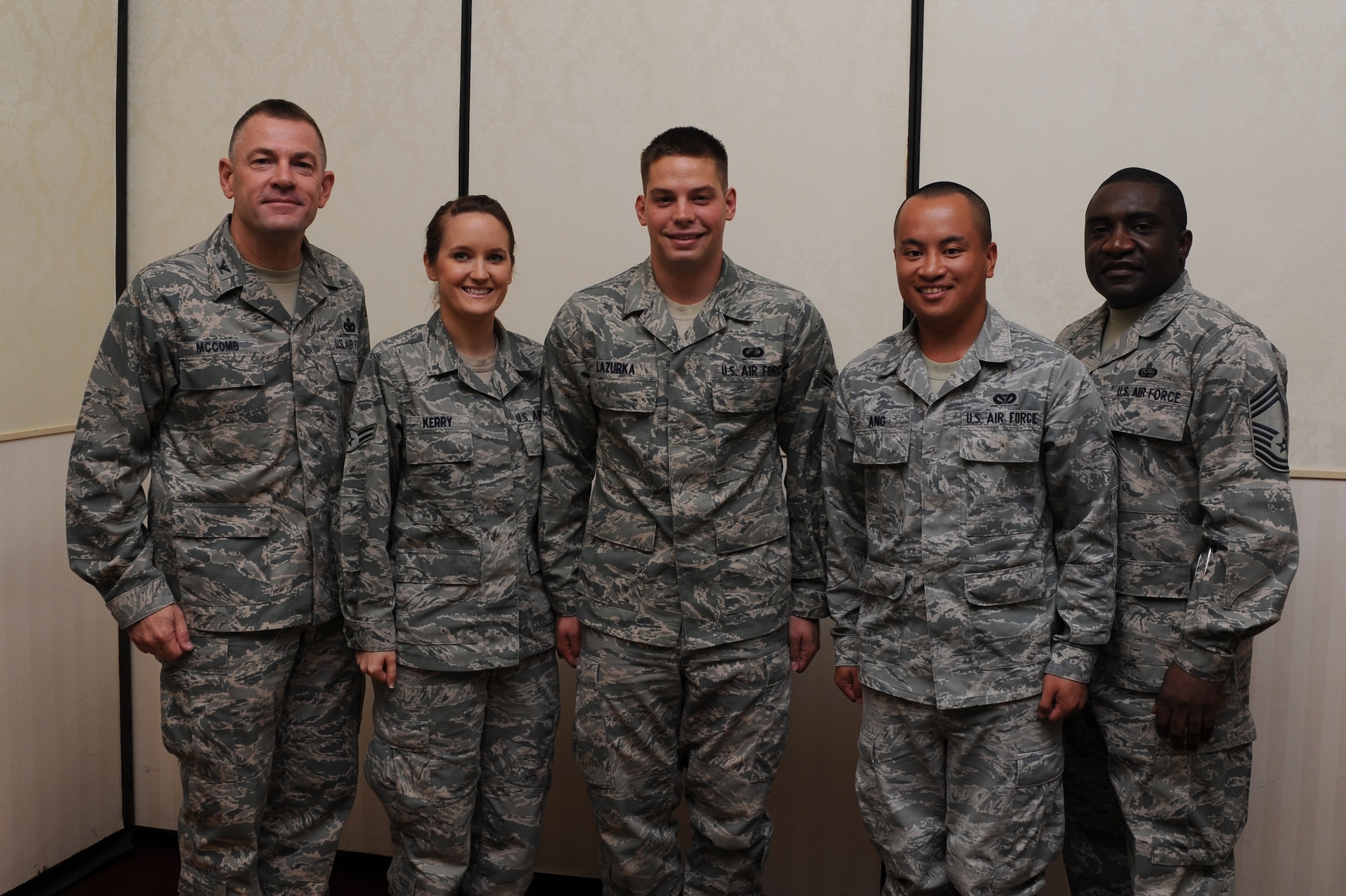 Col. Richard McComb (left) and Chief Master Sgt. Thomas Jackson recognize  Airmen 1st Class Krista Kerry, A1C Gabriel Lazurka and A1C Michael Ang as Diamond Sharp award winners during a ceremony at the Charleston Club Aug. 9. Diamond Sharp awardees are Airmen chosen by their first sergeants for their excellent performance. McComb is the Joint Base Charleston commander, Jackson is the 628th Communications Squadron superintendent, Kerry is from the 628th Logistics Readiness Squadron, Lazurka is from the 628th Comptroller Squadron and Ang is from the 628th Civil Engineer Squadron. Also receiving the Diamond Sharp award but not pictured was Senior Airman Johnny Scott from the 628th Contracting Squadron. (U.S. Air Force photo/Staff Sgt. Nicole Mickle)


