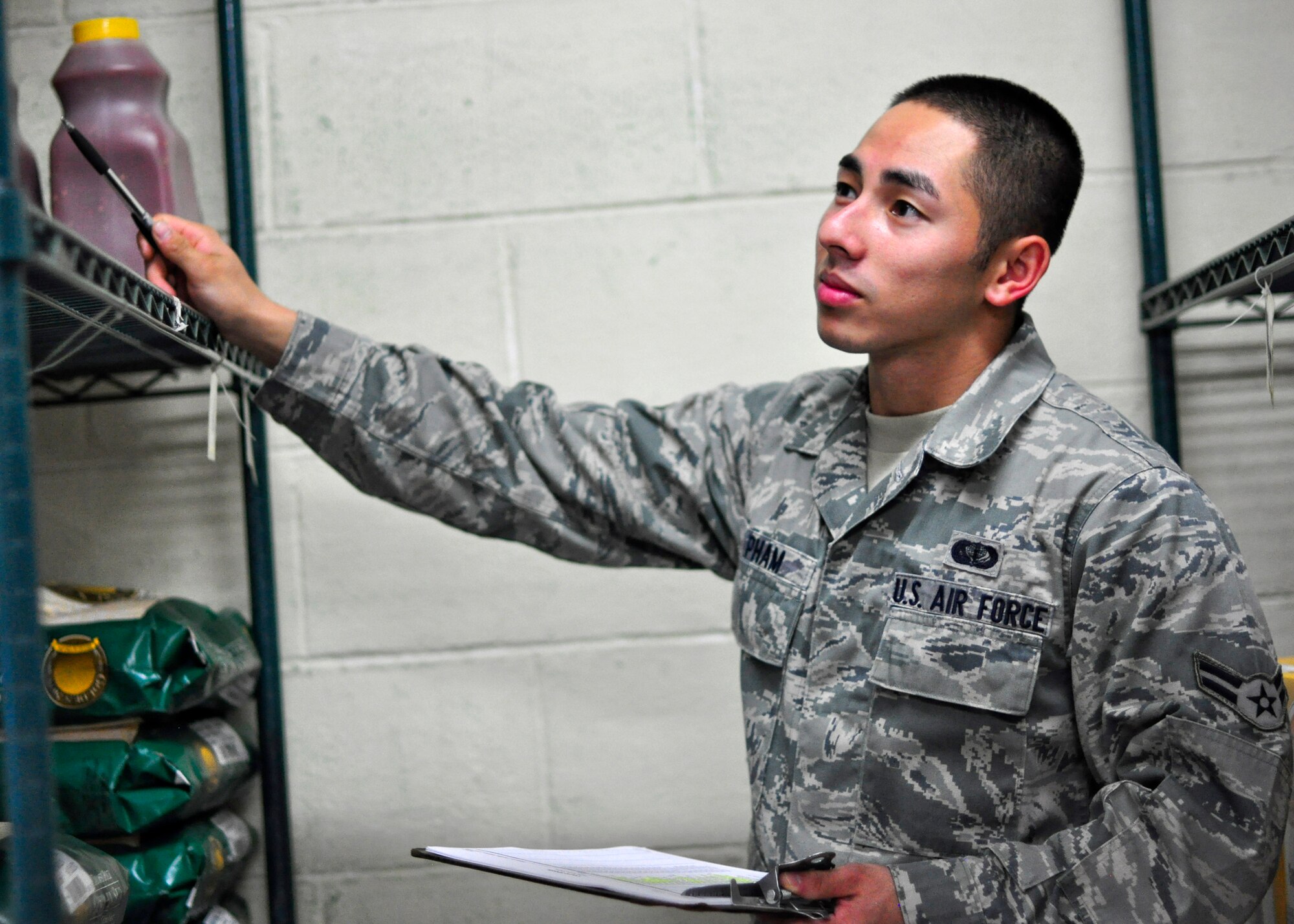 Airman 1st Class Fa Pham, 51st Force Support Squadron, performs an inventory on items in the storeroom at the Pacific House dining facility at Osan Air Base, Republic of Korea August 4, 2011. Pham was recently recognized for his hard work through the Airman Spotlight program. (U.S. Air Force photo/Tech. Sgt. Chad Thompson)