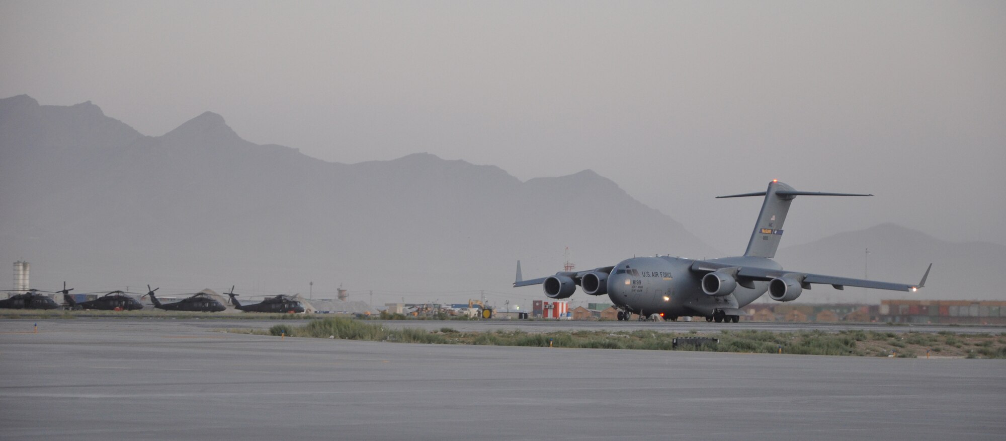 BAGRAM AIRFIELD, Afghanistan -- A C-17 Globemaster III takes off after being loaded with cargo by the 455th Expeditionary Aerial Port Squadron here August 1, 2011. The 455 EAPS’s mission is moving passengers and cargo all throughout Afghanistan. More than 80 percent of all people and supplies traveling through the country come through 455 EAPS. (U.S. Air Force photo/Capt. Korry Leverett)