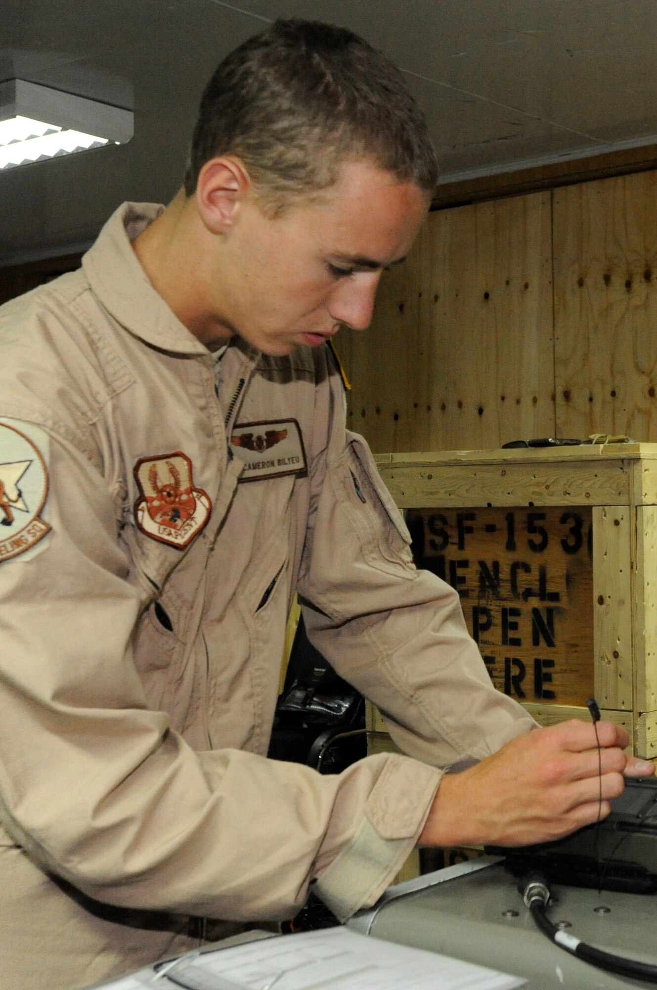 Airman 1st Class Cameron Bilyeu enters data into the roll-on, beyond-line-of-sight enhancement system to configure it for operational use during a training session at the Transit Center at Manas, Kyrgyzstan, Aug. 5. The ROBE system dramatically increases the reach of tactical communications making the KC-135 Stratotanker a communications center capable of relaying decision-making information around the world. Bilyeu is deployed to the 22nd Expeditionary Air Refueling Squadron as a boom operator. He is deployed here from Fairchild Air Force Base, Wash. (U.S. Air Force photo/Tech. Sgt. Tammie Moore)