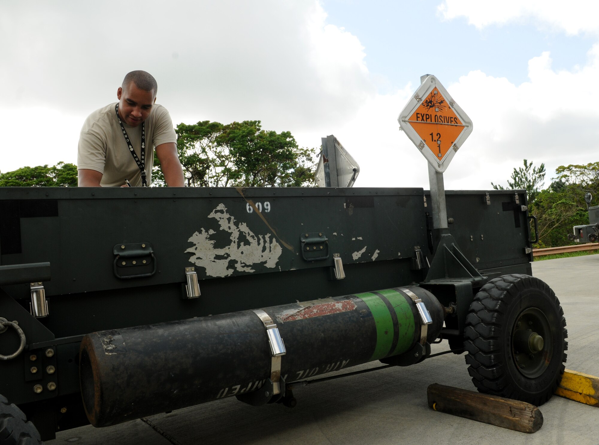 Senior Airman Ryan Morris, 18th Munitions Squadron conventional maintenance crewmember, verifies the correct cargo movement for transportation Aug.10 during Beverly High 11-6, a Local Operational Readiness Exercise at Kadena Air Base, Japan. The LORE is an exercise that almost all Airmen at Kadena participate in to hone skills and keep them sharp in case of real-world emergencies. (U.S. Air Force photo/Airman 1st Class Jarvie Z. Wallace)
