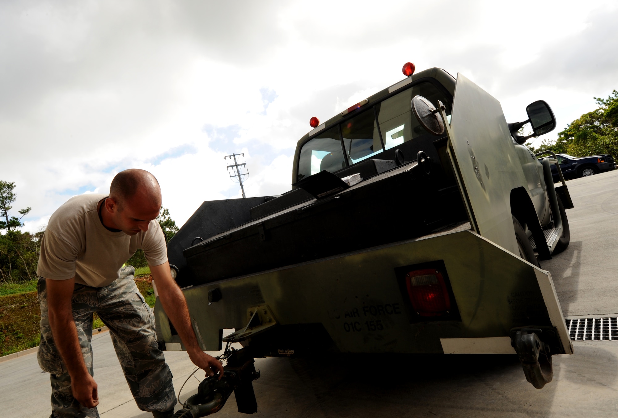 Airman 1st Class Jordan Addotta, 18th Munitions Squadron conventional maintenance crewmember, secures a munitions trailer Aug.10 during Beverly High 11-6, a Local Operational Readiness Exercise at Kadena Air Base, Japan. During the exercise, Kadena's Airmen tested their abilities to deploy to and operate in a contingency environment. (U.S. Air Force photo/Airman 1st Class Jarvie Z. Wallace)
