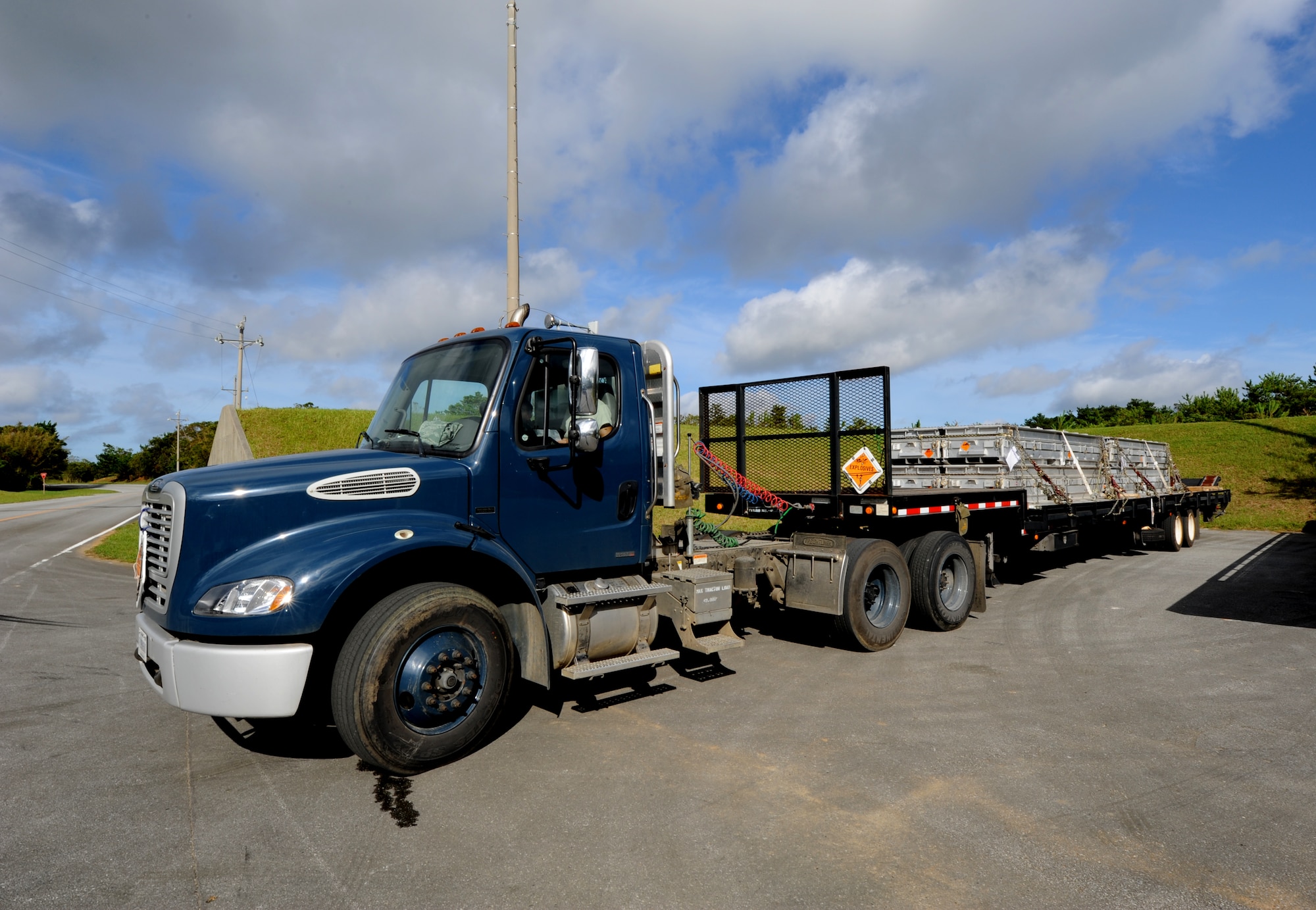 A truck carries a munitions shipment Aug.10 during Beverly High 11-6, a Local Operational Readiness Exercise at Kadena Air Base, Japan. The 18th Wing is participating in the LORE Aug 10-12 to test the readiness of Kadena Airmen. (U.S. Air Force photo/Airman 1st Class Jarvie Z. Wallace)

