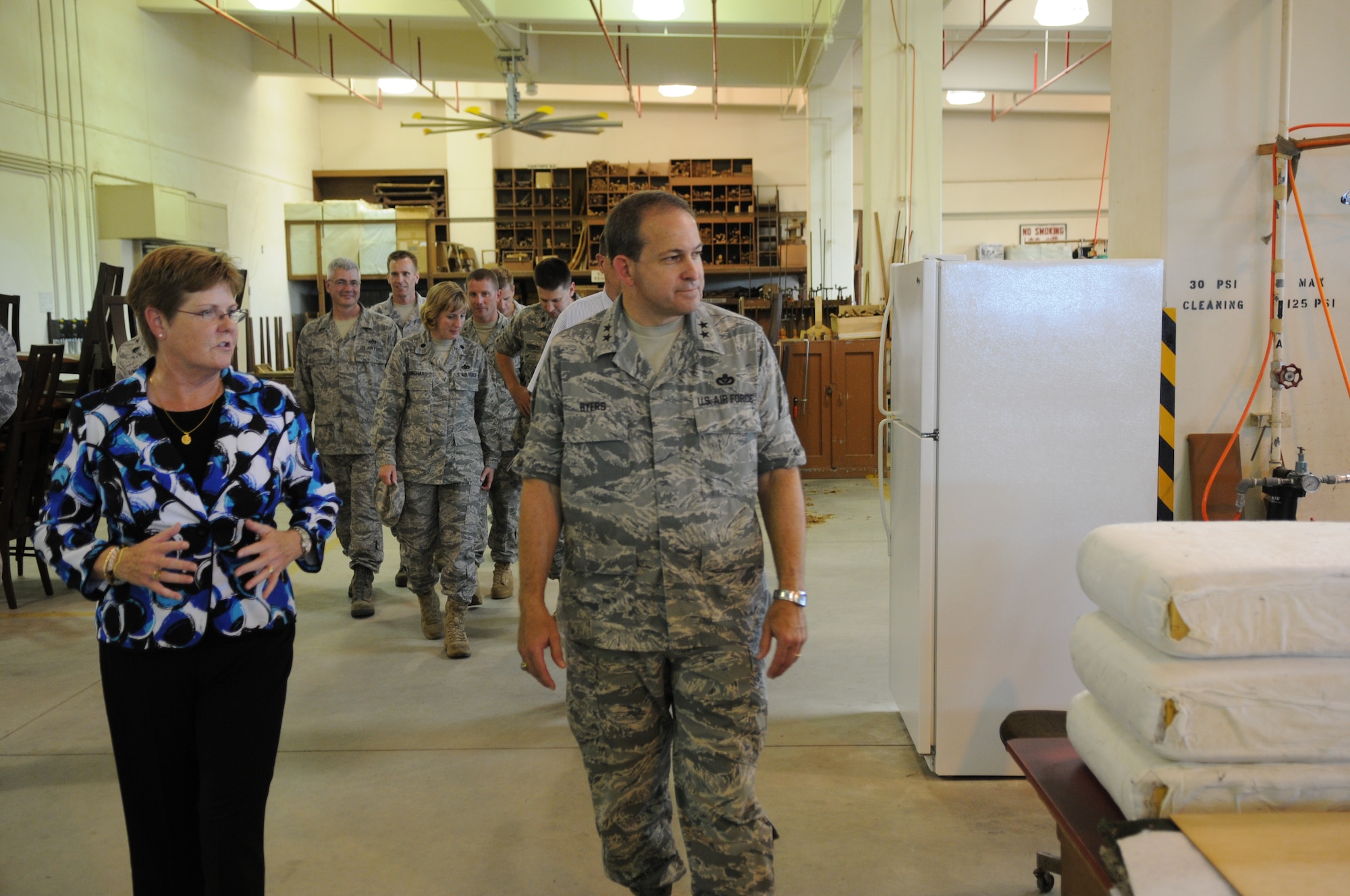 Melinda Faires, 718th Civil Engineer Squadron Housing Flight employee, describes
Kadena's Furnishings Management Office operations to Maj. Gen. Timothy A. Byers, Air Force Civil Engineer, during his visit to Kadena Air Base, Japan, in July. Kadena's FMO office manages an inventory of more than 75,000 furniture items and appliances, supporting 12,000 accompanied and unaccompanied personnel at locations across Okinawa. (U.S. Air Force photo/Airman 1st Class Jarvie Z. Wallace)